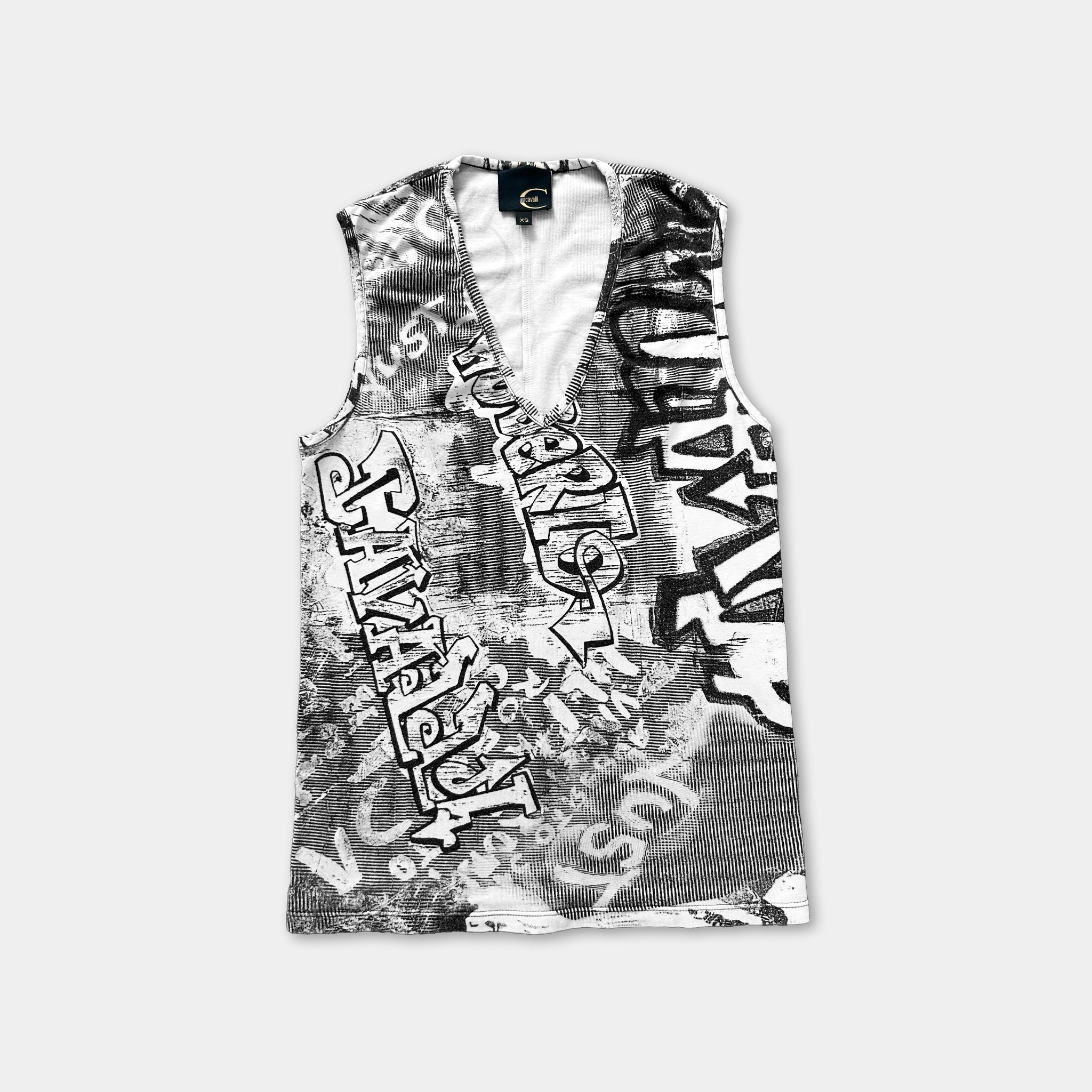 a sleeveless top with a black and white graffiti-style design.