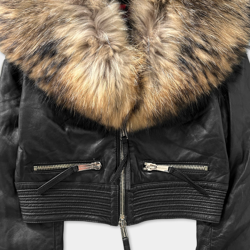 A close-up view of a black leather jacket with a fur collar and zipper details.
