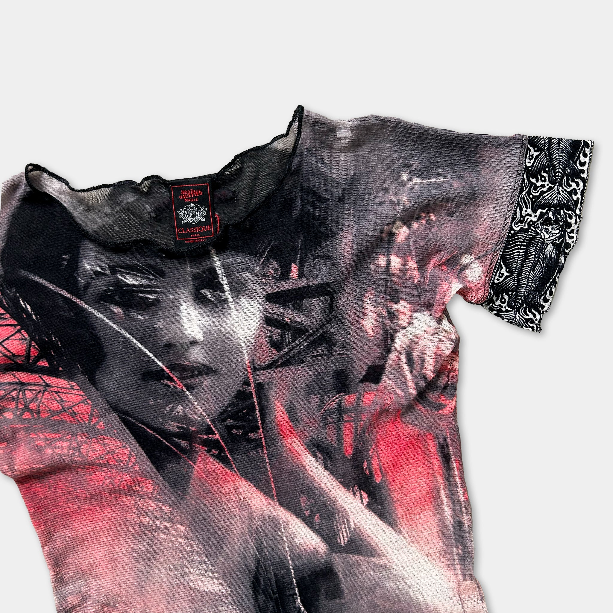 a close-up view of a black and red patterned shirt with a woman's face printed on it.