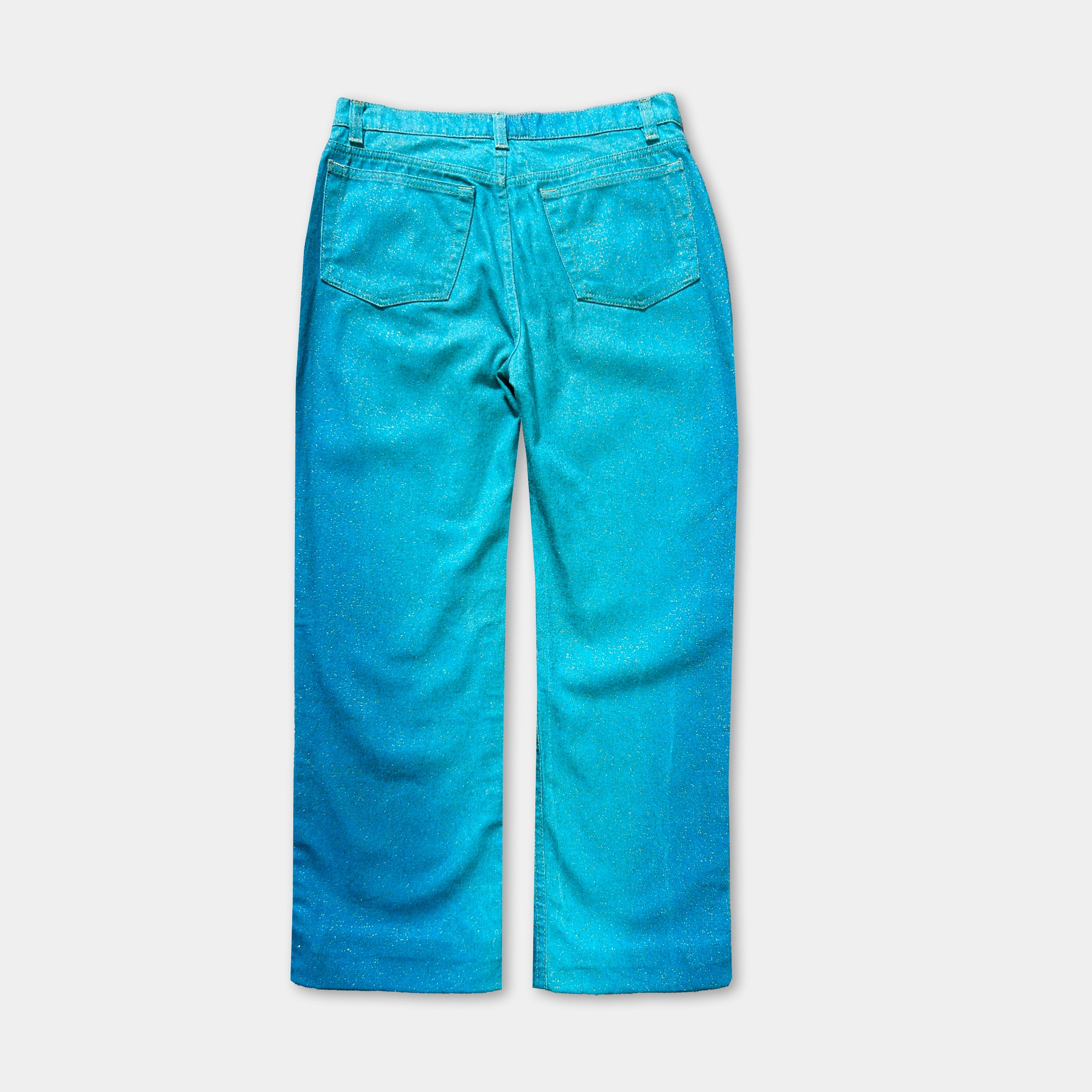 A pair of blue jeans with a glittery, sparkly effect.