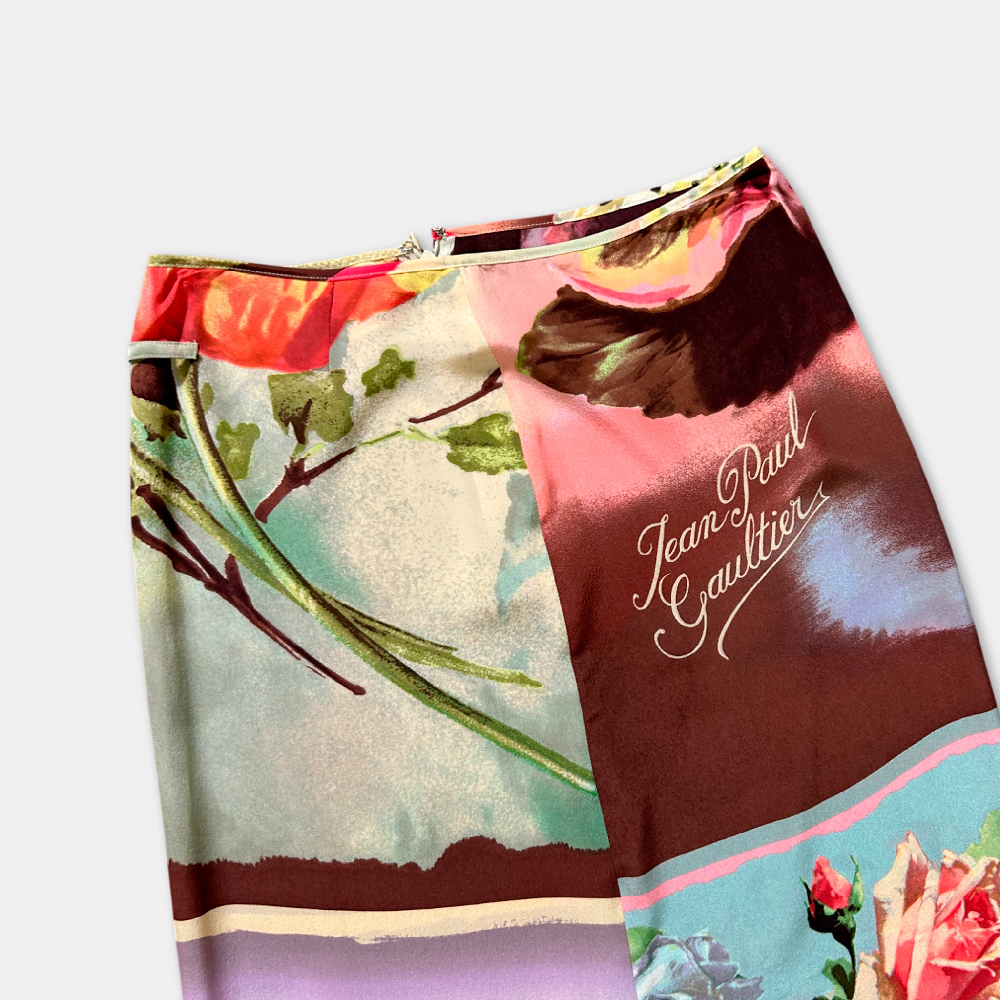 a colorful printed skirt with floral and abstract patterns.
