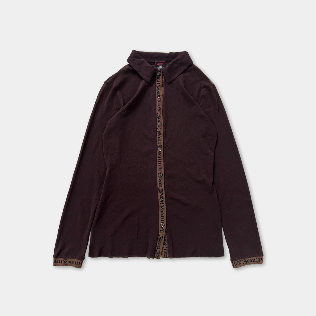 A dark brown long-sleeved shirt with a zipper and a collar.