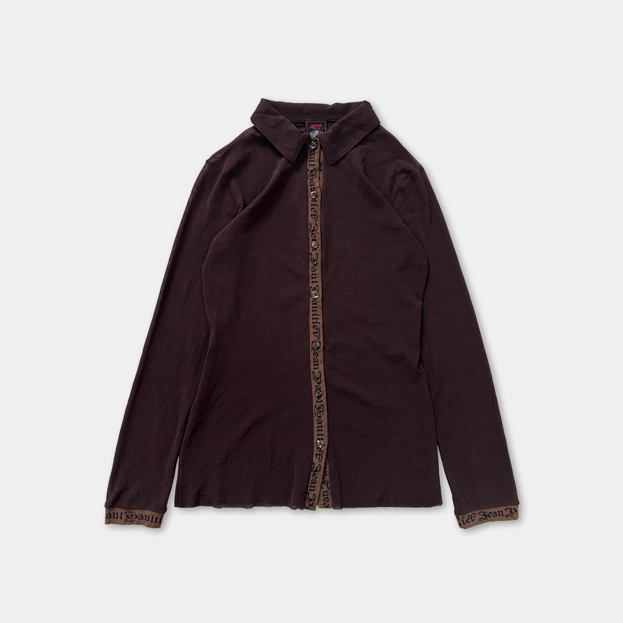A dark brown long-sleeved shirt with a zipper and a collar.