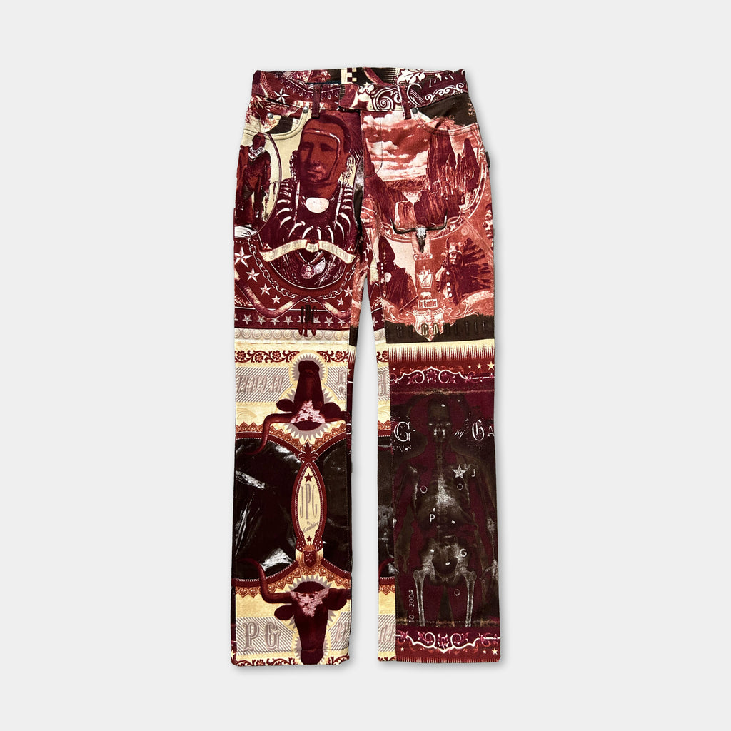 a pair of pants with a vibrant, colorful, and intricate design. The pants are adorned with various patterns and images, including a prominent figure, a floral motif, and a geometric pattern. The overall design is visually striking and eye-catching, making it a unique and interesting piece of clothing.