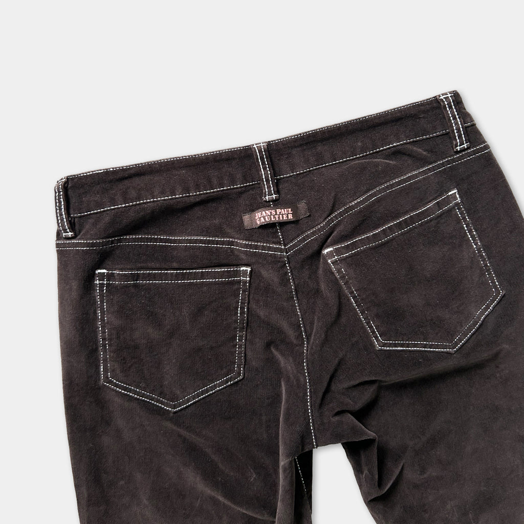 a pair of dark grey, high-waisted jeans with a white stitching detail.