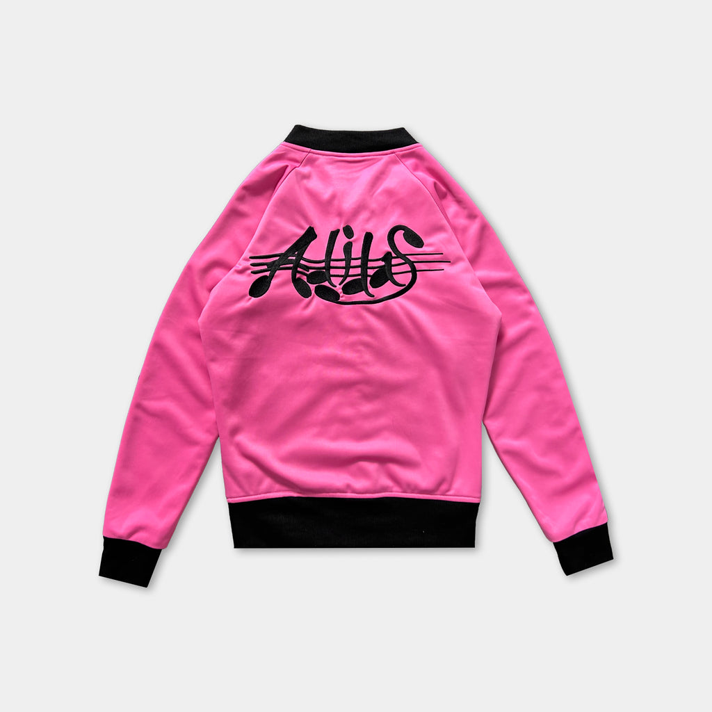 A bright pink sports jacket with black text on the back.