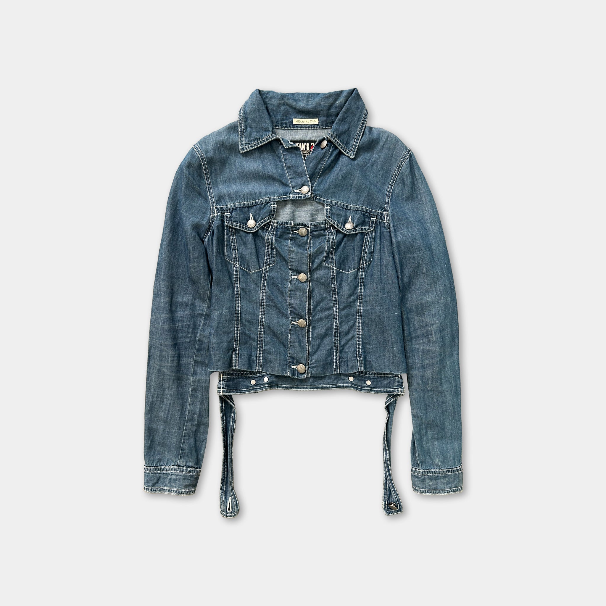 A denim jacket with a button-down front and long sleeves, displayed against a plain background.
