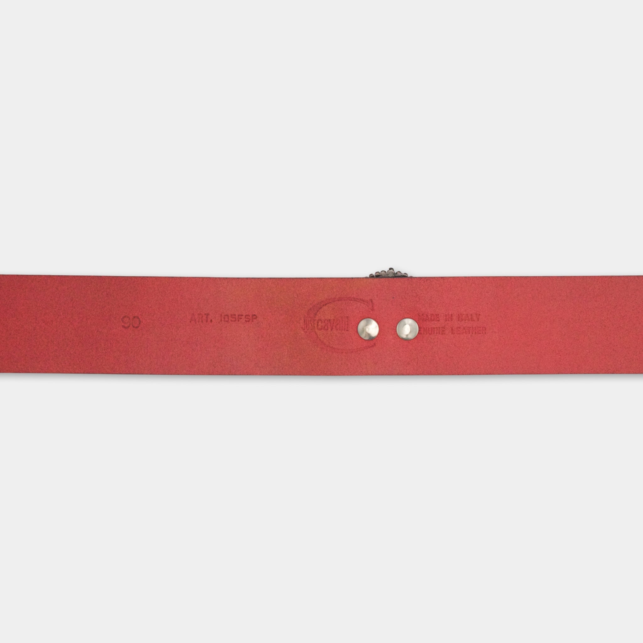 A red leather belt with the text "CO.AT. JOSEP. SPF" printed on it.