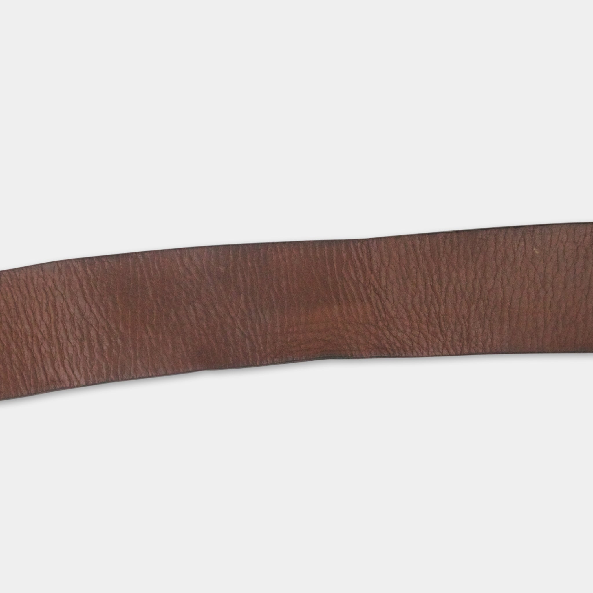 A close-up view of a brown leather belt against a white background.