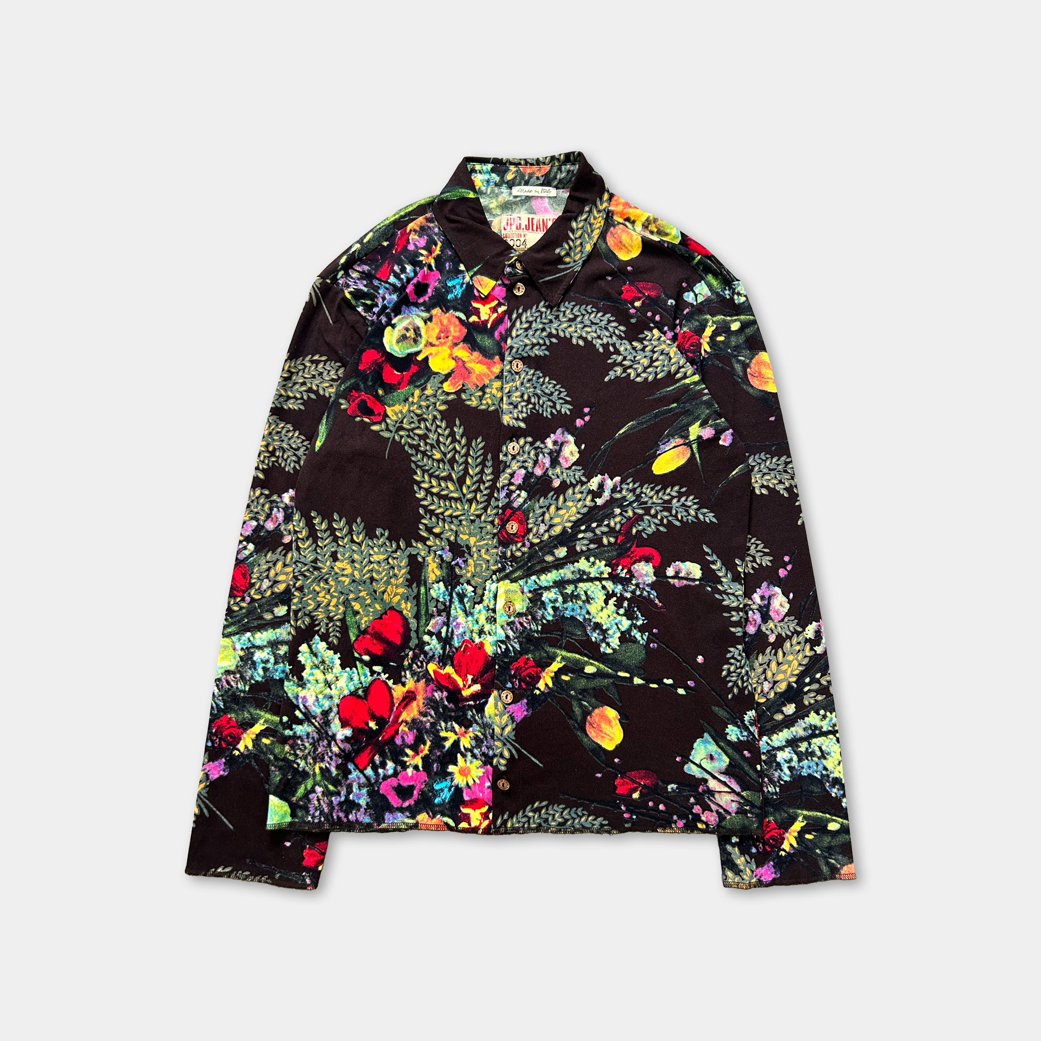 a long-sleeved shirt with a vibrant, colorful floral print.