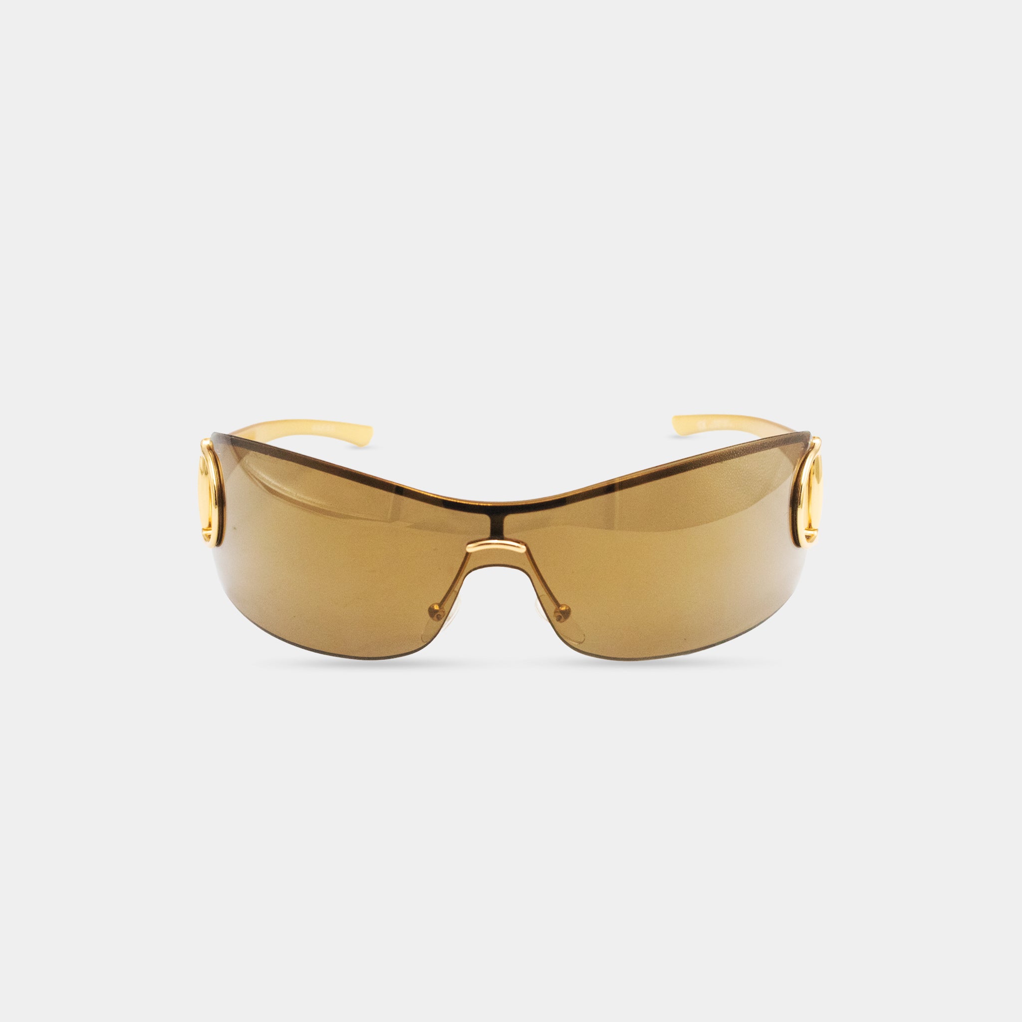 A pair of brown sunglasses with gold accents, displayed against a white background.