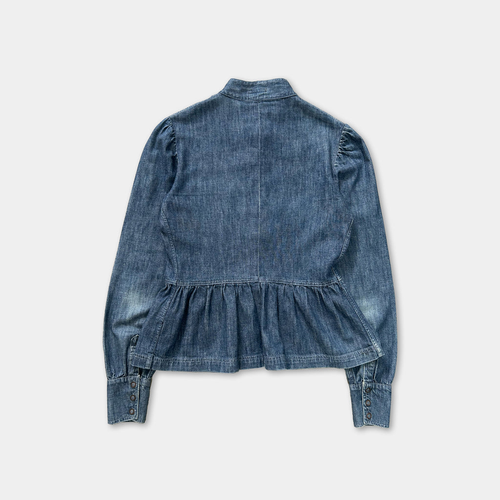 A denim jacket with a ruffled collar and puffed sleeves, displayed against a white background.