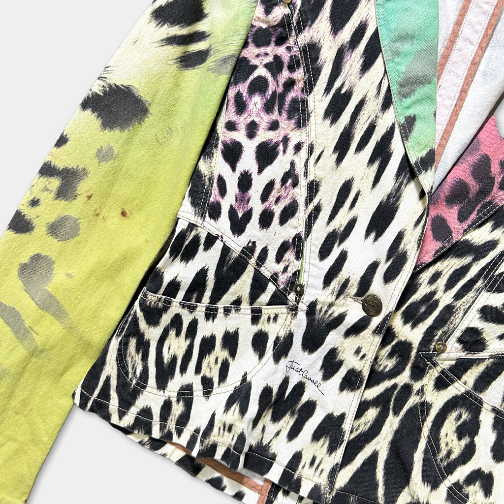 a jacket with a leopard print pattern, featuring a mix of black, white, and pink colors.