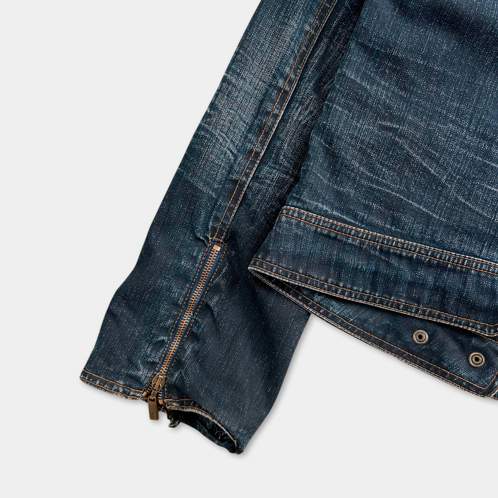 A close-up view of a pair of blue jeans with a zipper running down the front.