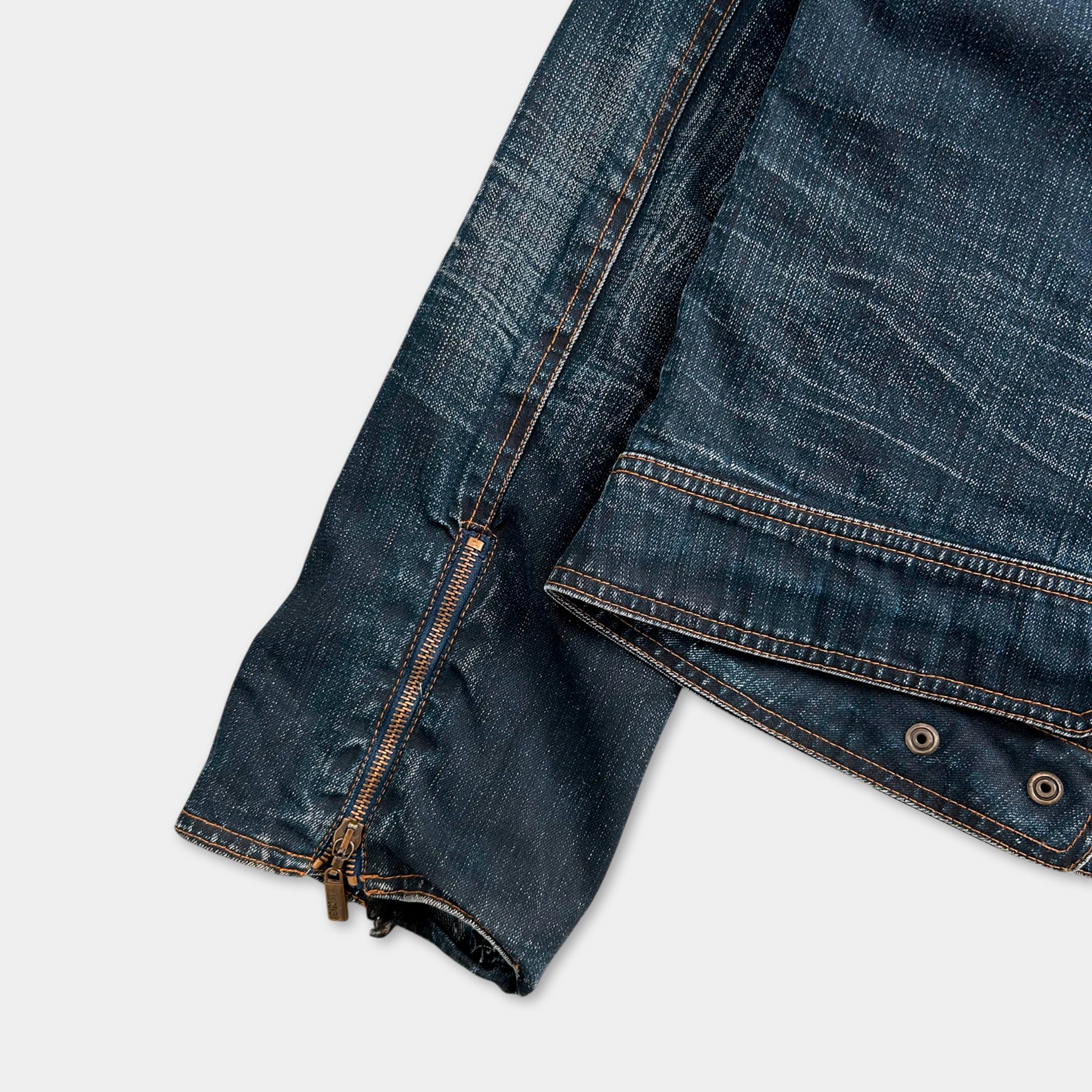 A close-up view of a pair of blue jeans with a zipper running down the front.
