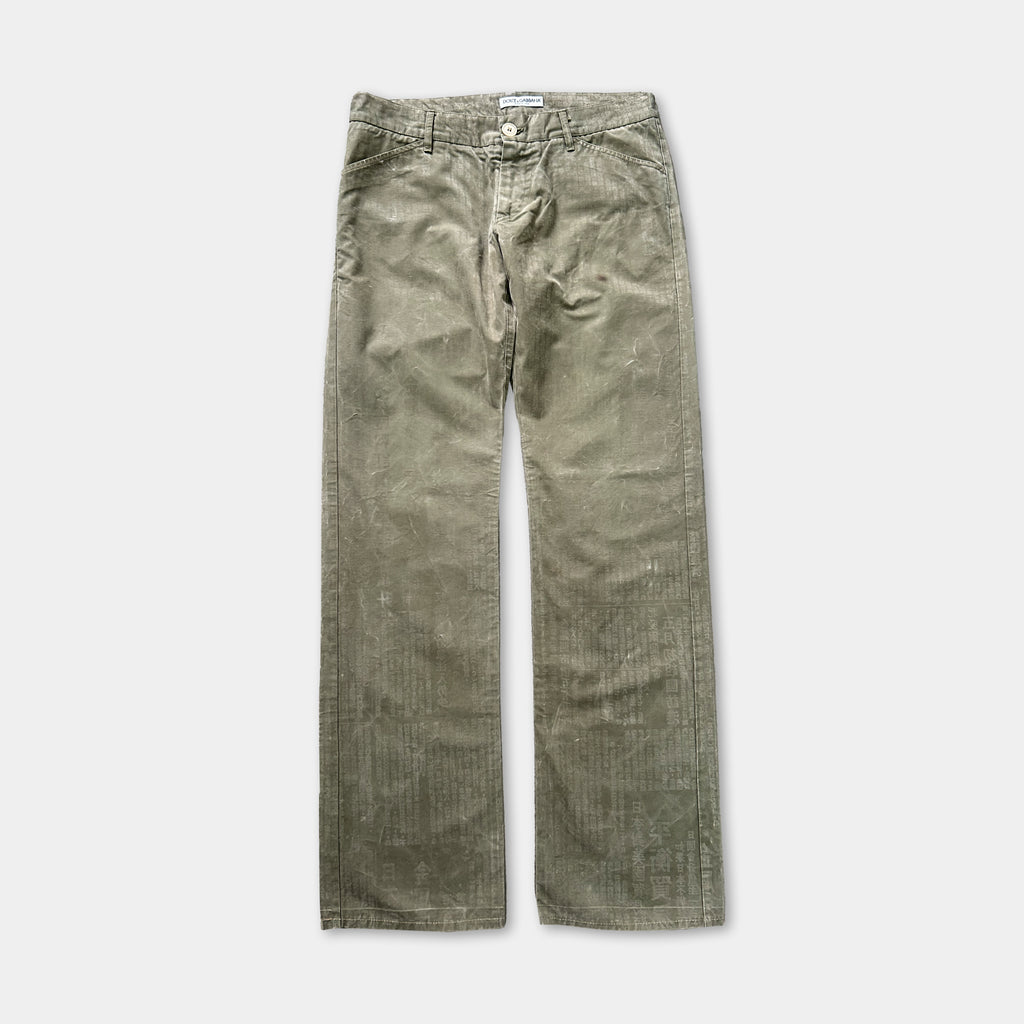 A pair of olive green, wide-leg pants with a button closure.