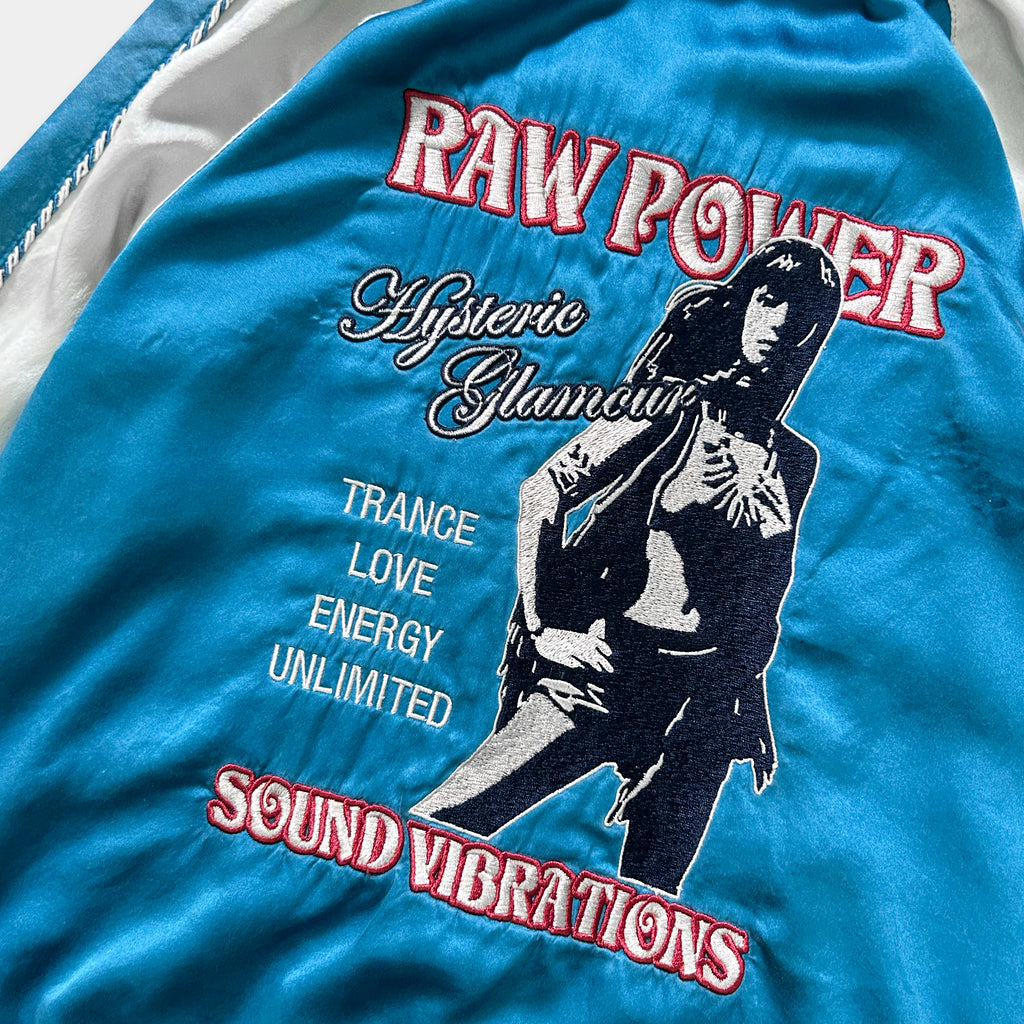 a blue jacket with a graphic design and text on it.