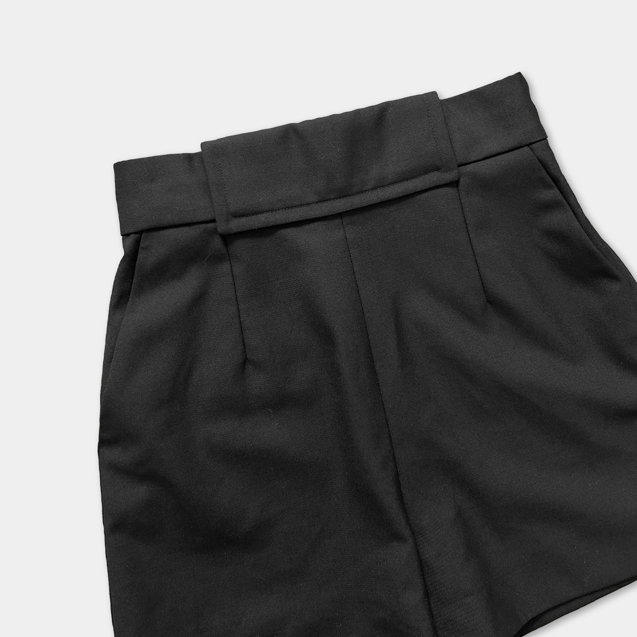 A pair of black shorts with a belt.