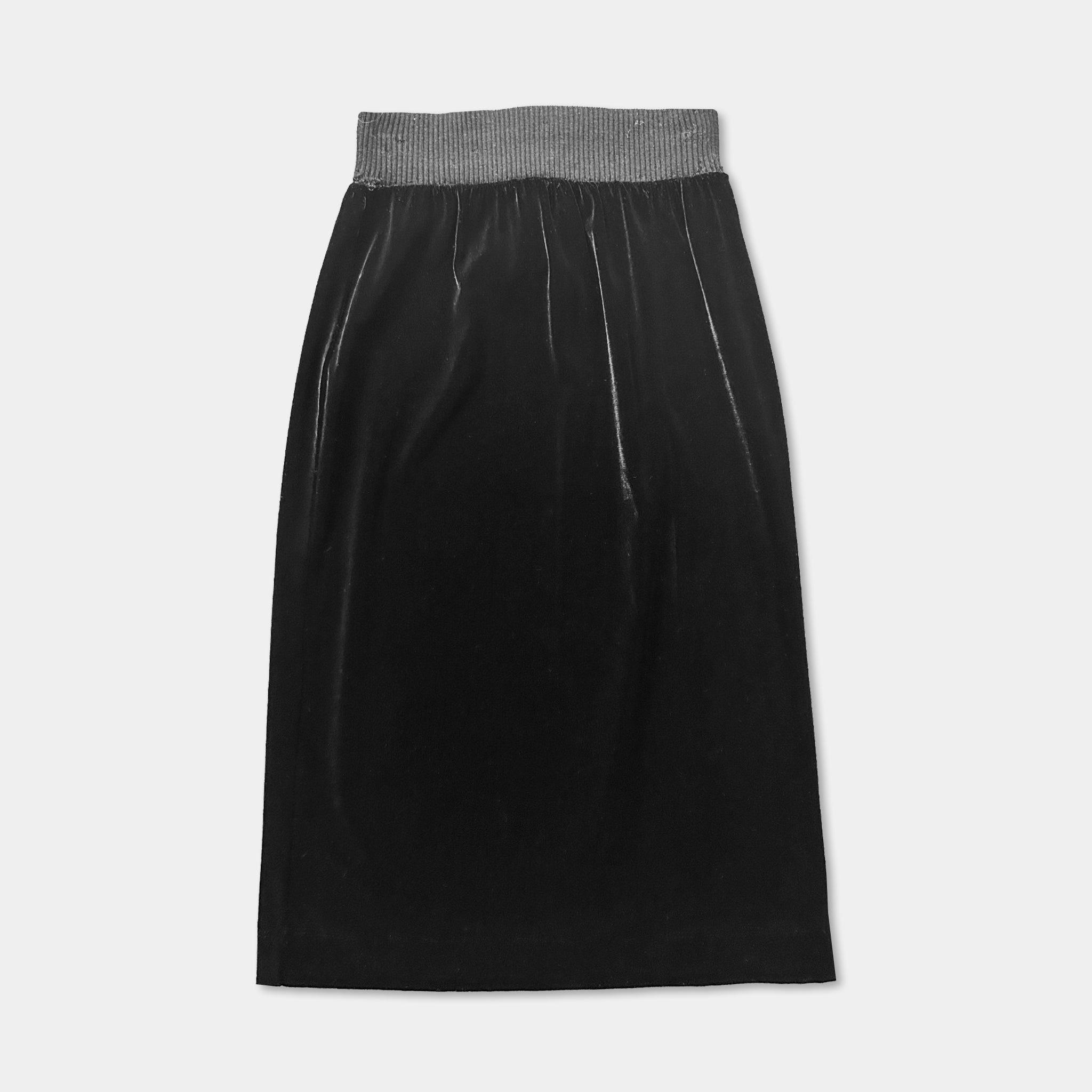 A black velvet skirt with a metallic waistband.