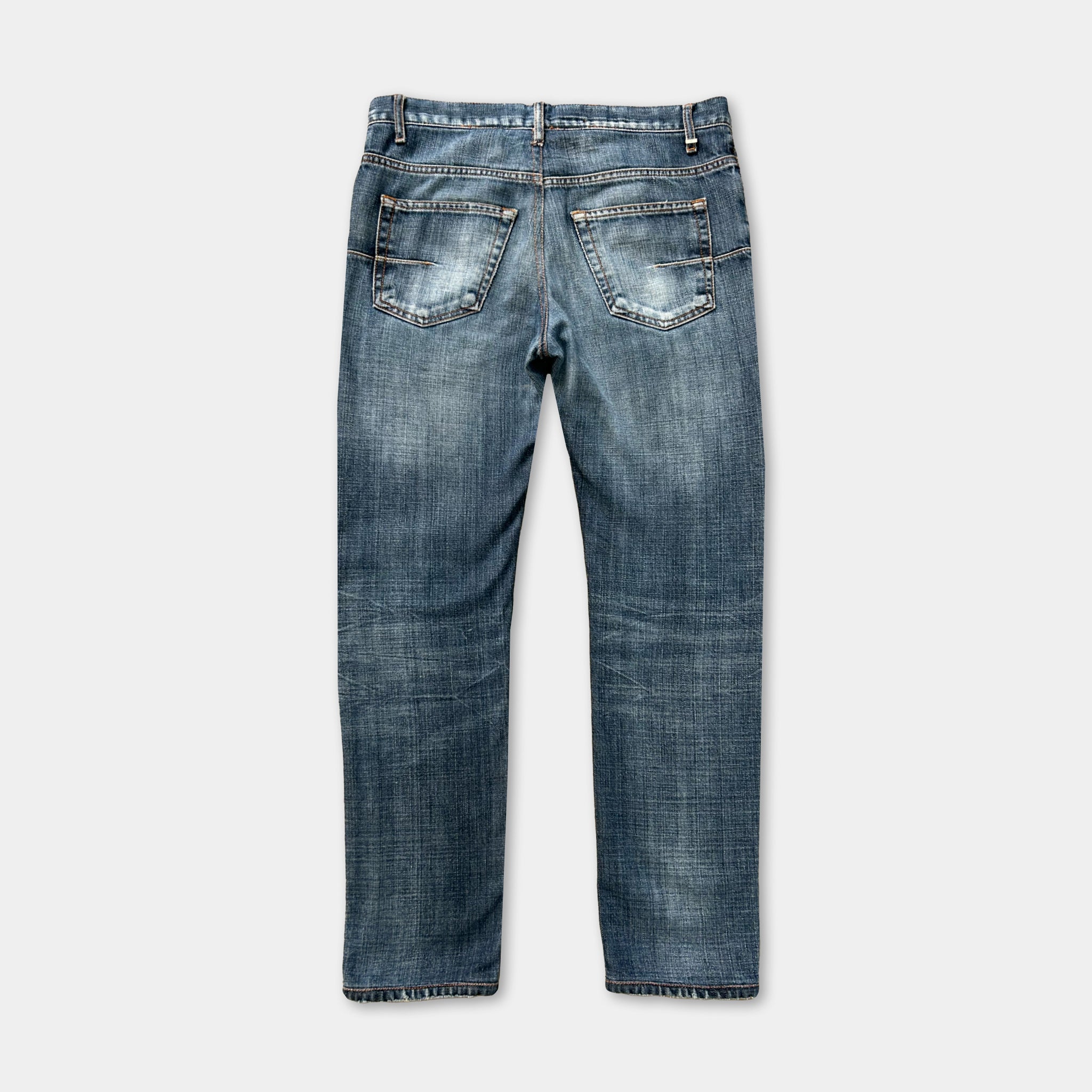 A pair of blue jeans with a faded, distressed appearance.