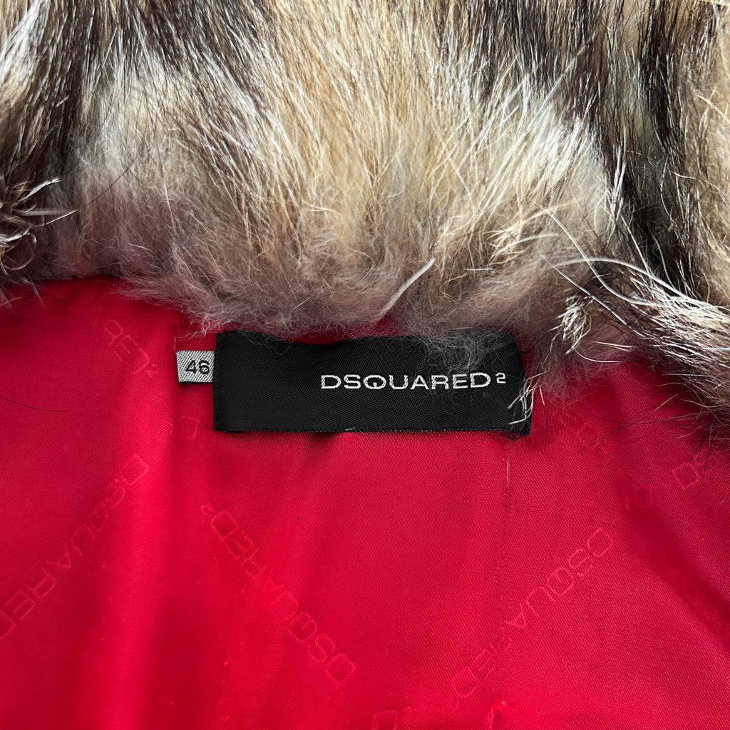 a close-up view of a red fabric with a black label that reads "DSQUARED" and a number "46" on it.