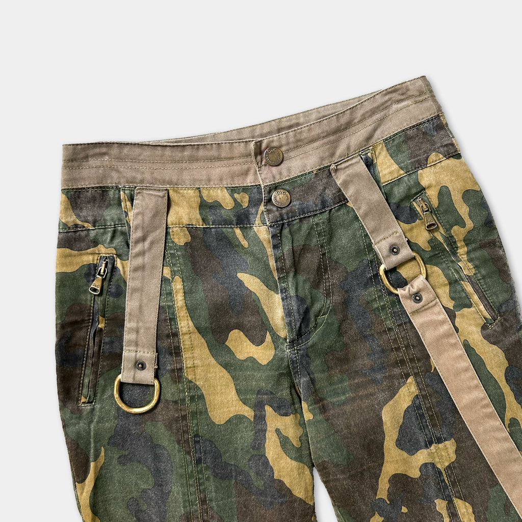 Camouflaged cargo pants with metal buckles and zippers.