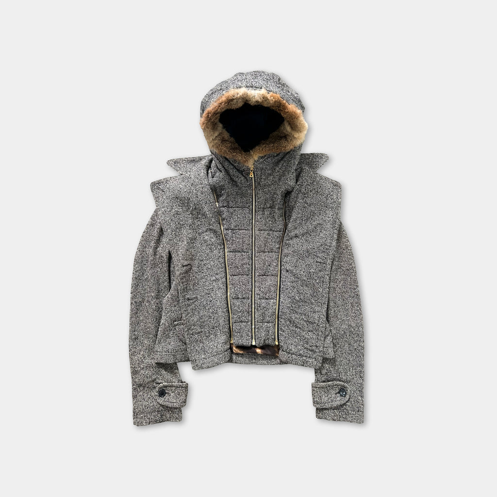 A gray hooded jacket with a fur lining and zipper.
