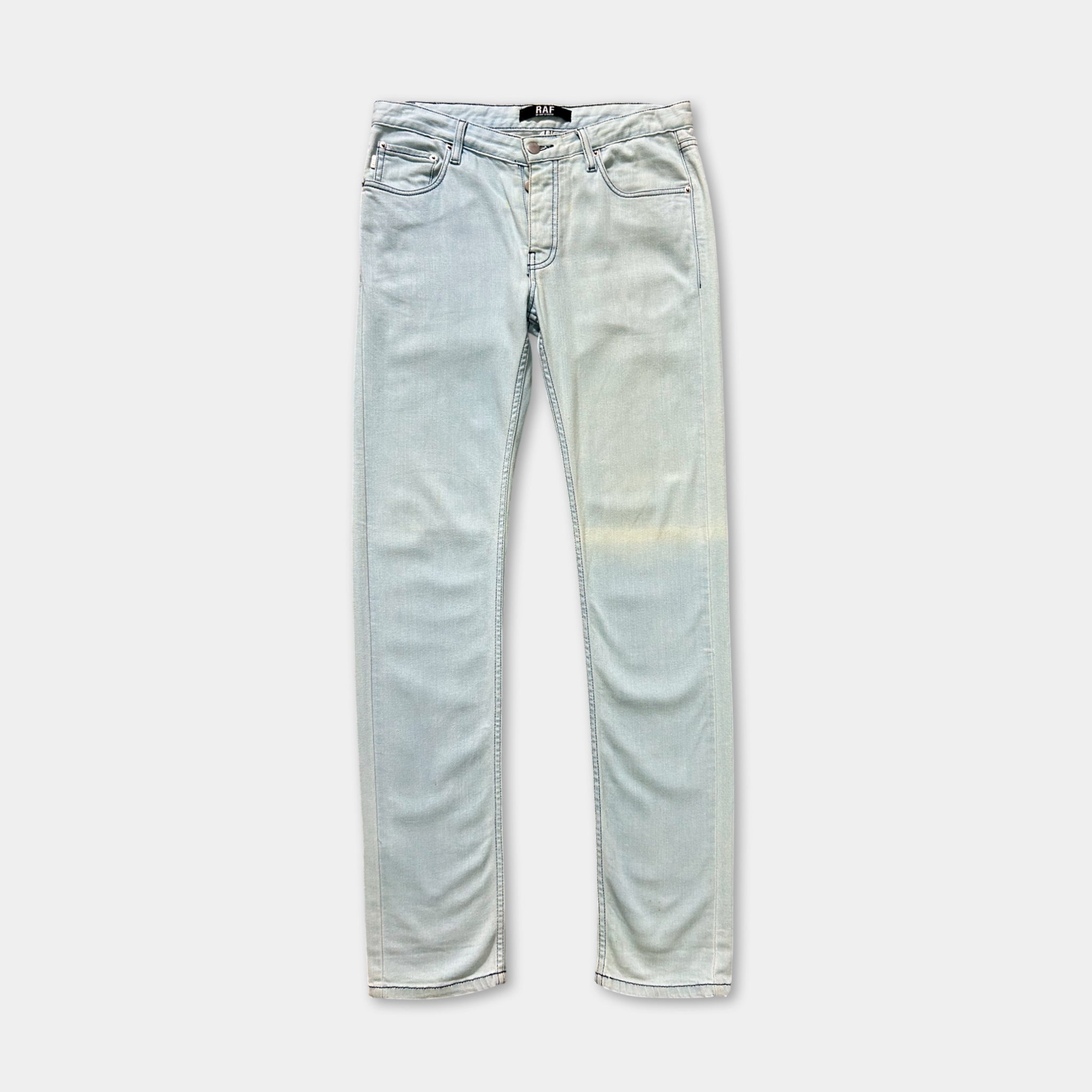 A pair of light blue denim jeans with a faded wash, displayed against a plain background.