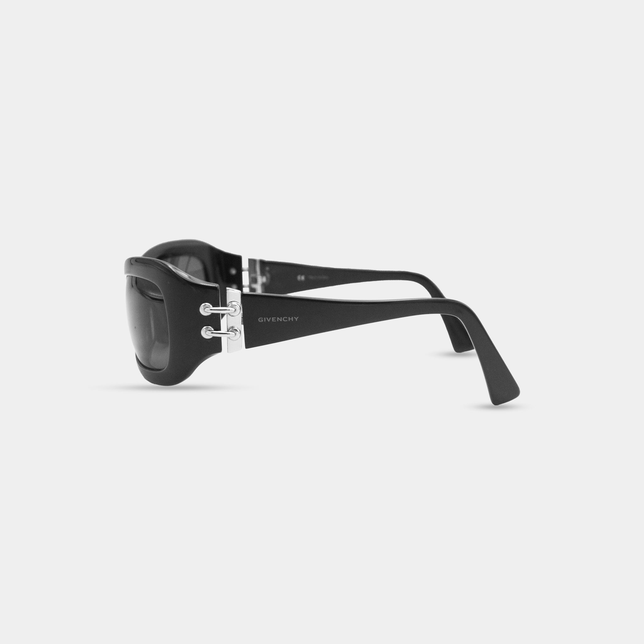 A pair of black sunglasses with the Givenchy logo visible on the frame.