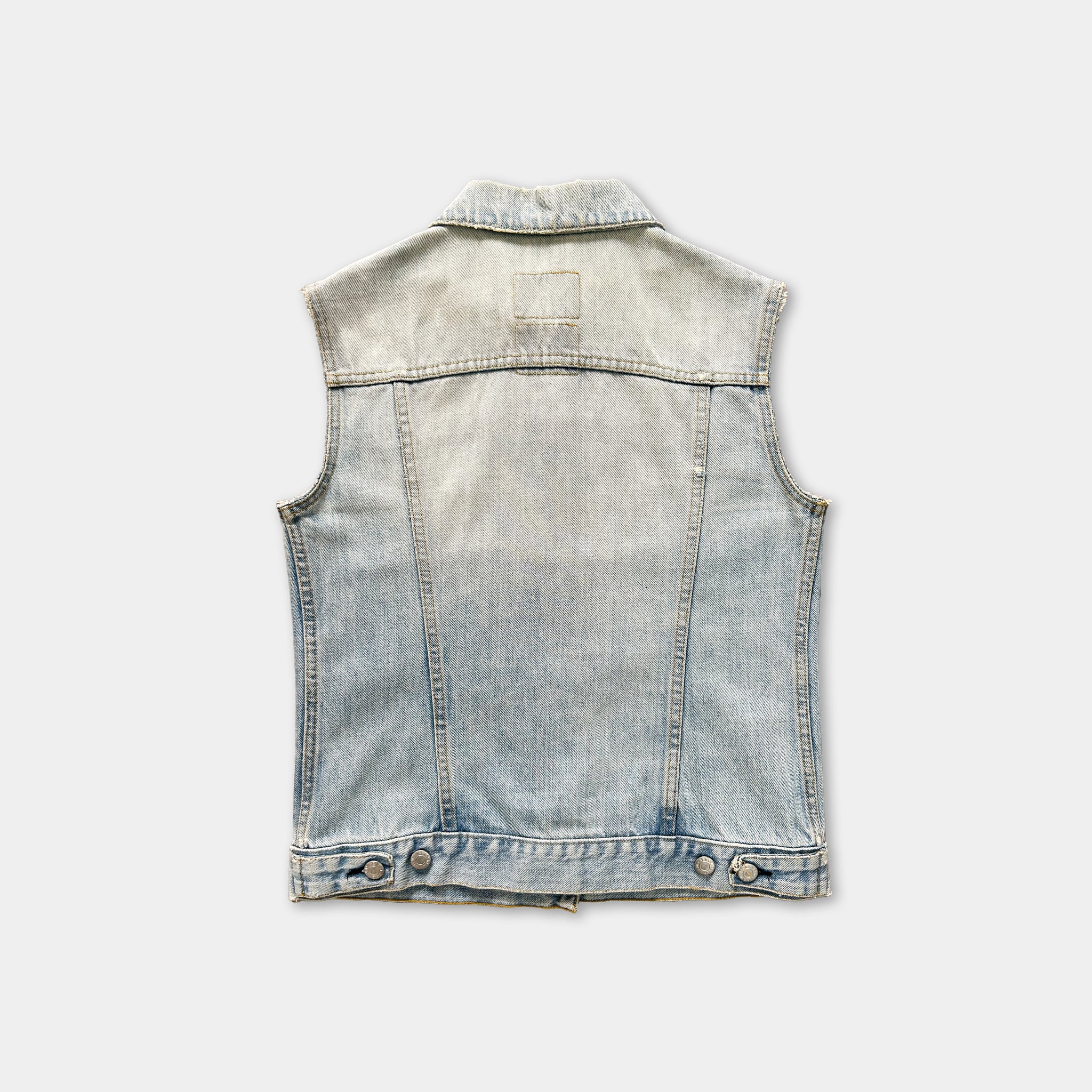 A denim vest with a button-down front and a collar, displayed against a plain background.
