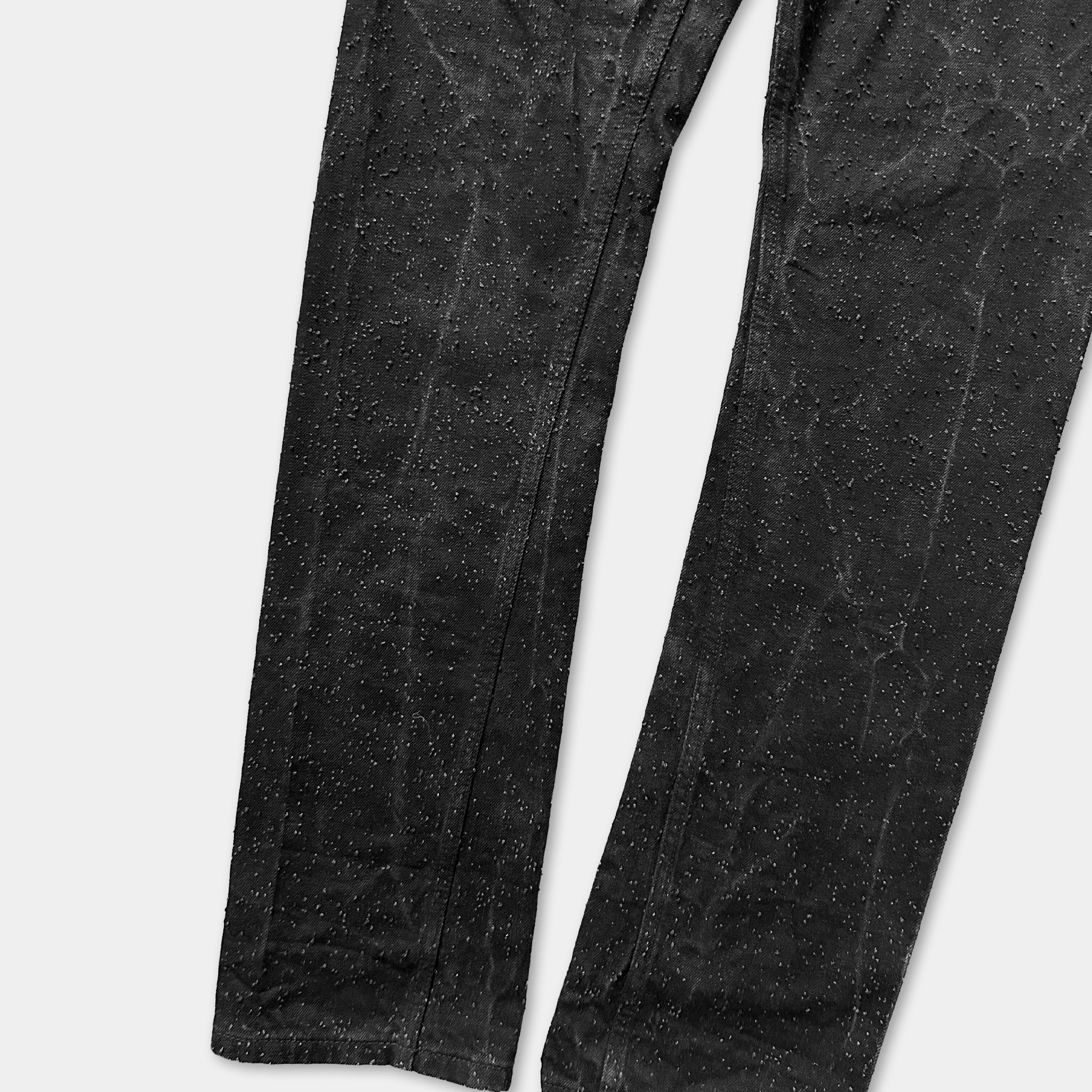 a pair of black pants with a speckled or speckled pattern on them.