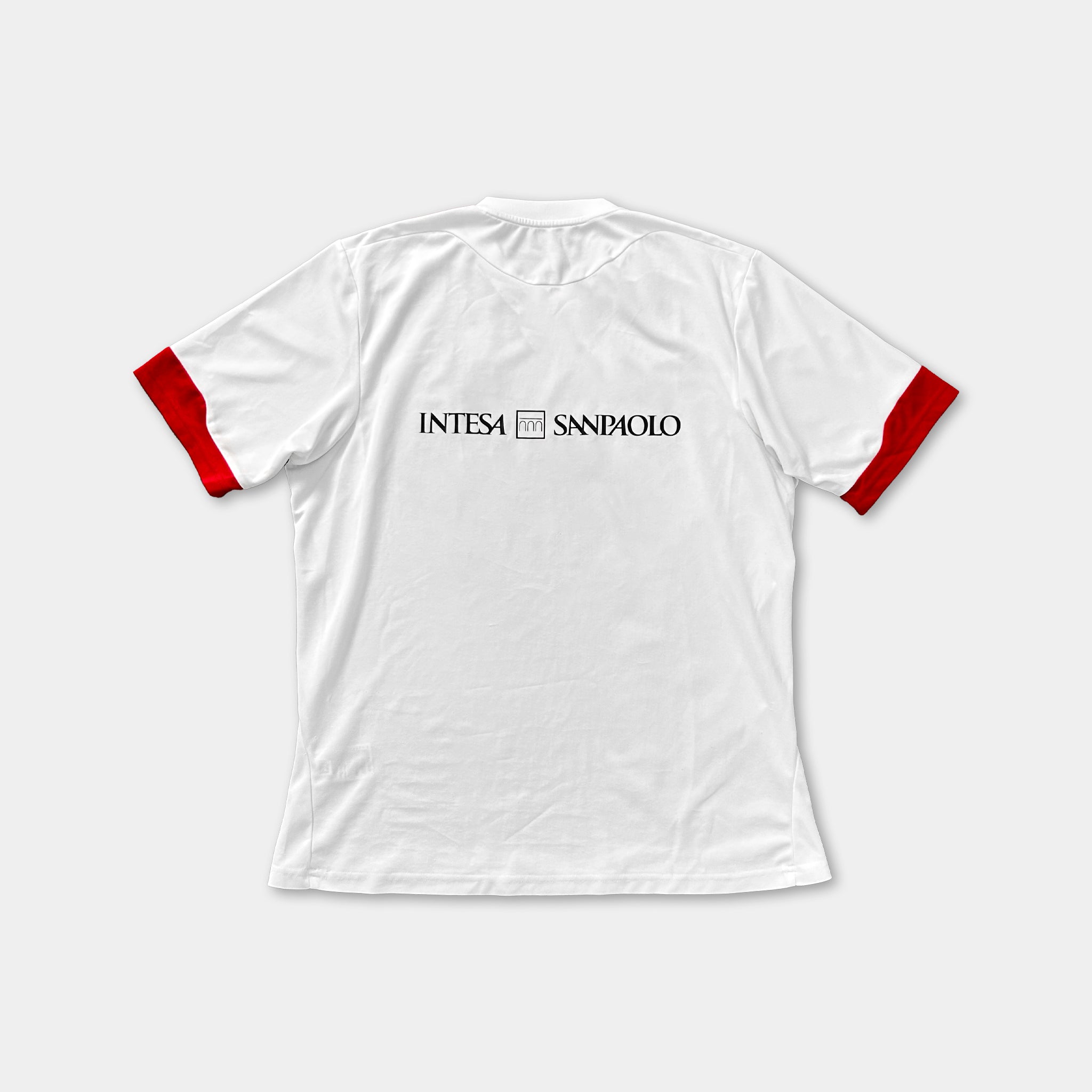 A white sports jersey with red accents, featuring the text "INTESA S.N.P.I.O.L.O." printed on the back.