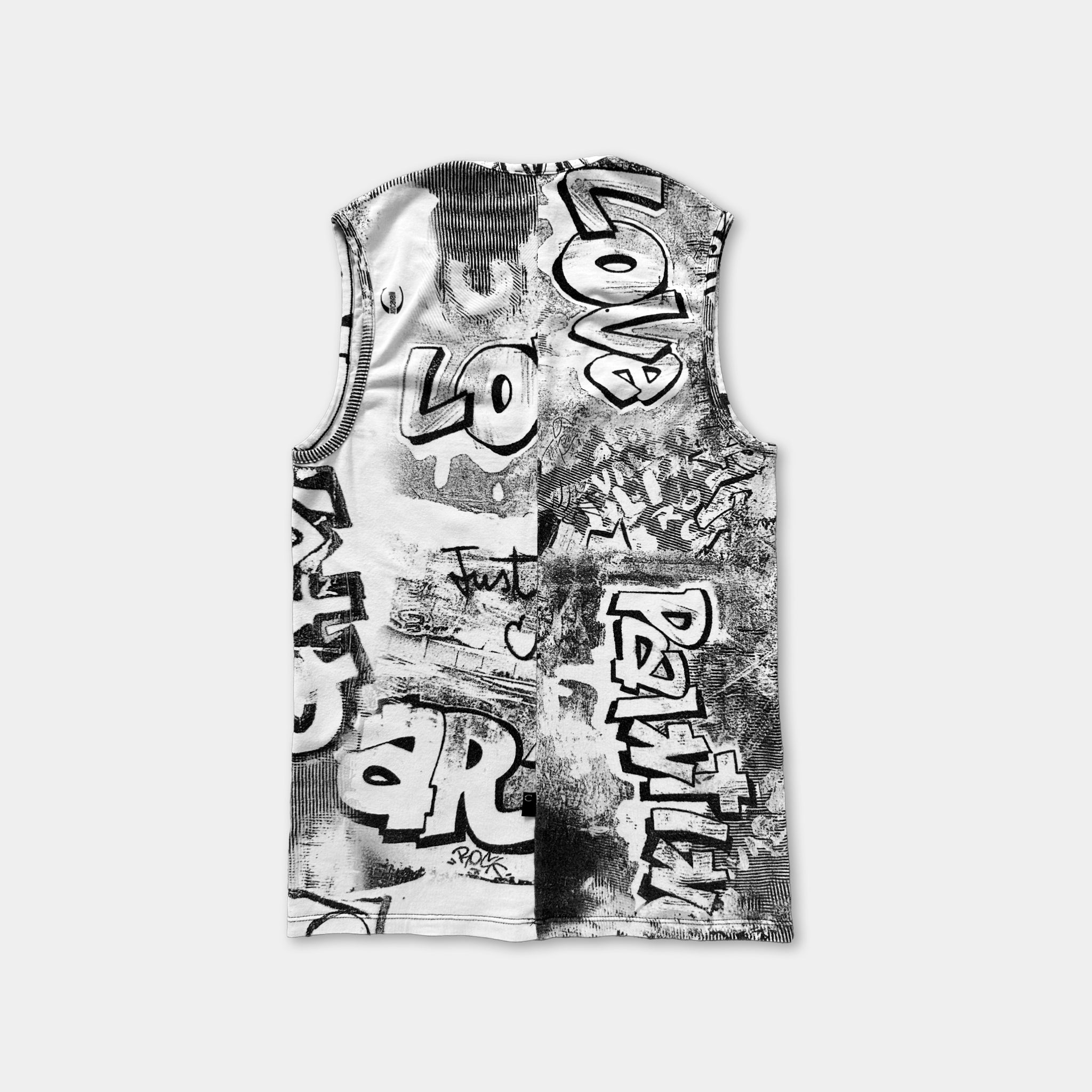 a sleeveless top with a black and white graffiti-style design.