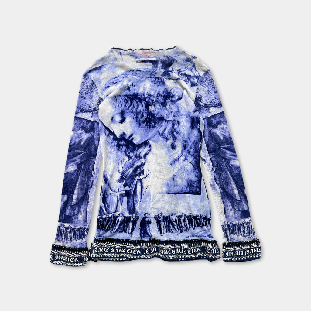 a long-sleeved shirt with a blue and white printed design depicting a woman's face.
