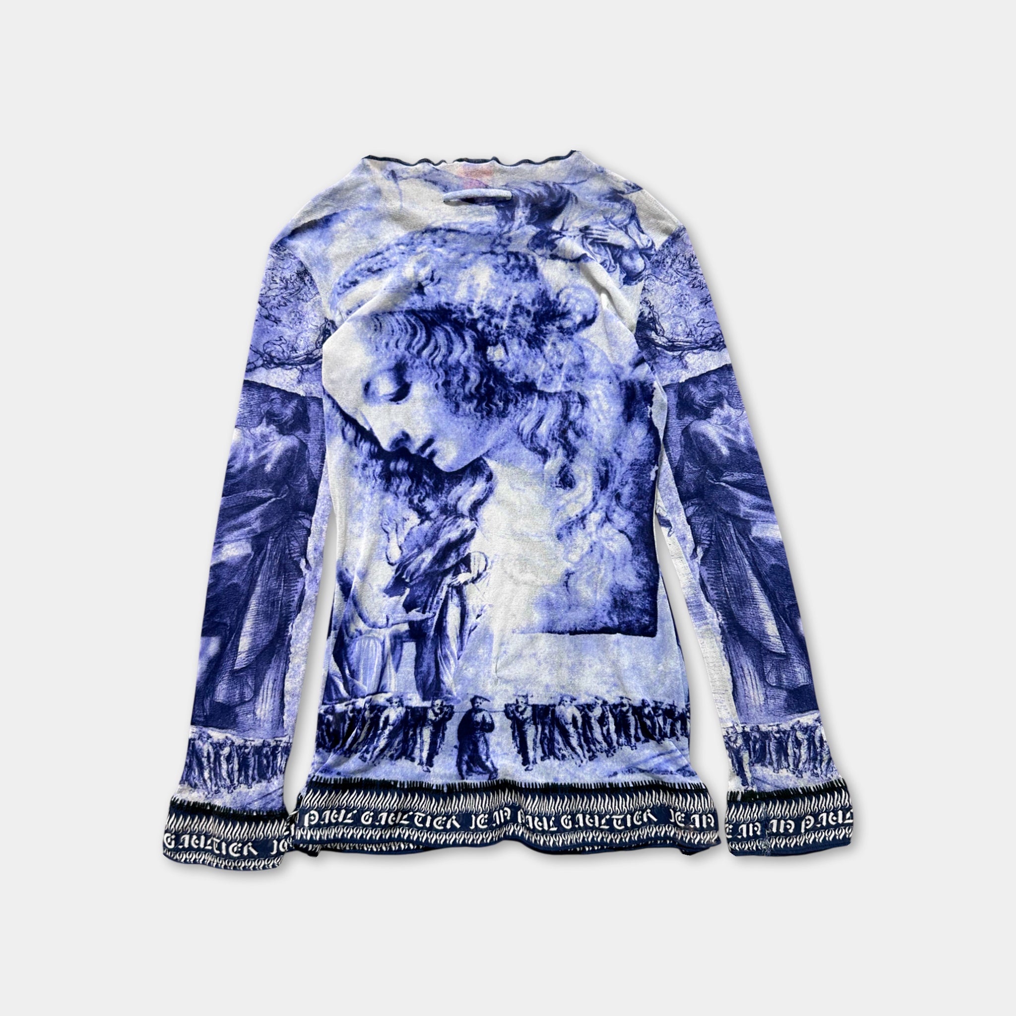a long-sleeved shirt with a blue and white printed design depicting a woman's face.