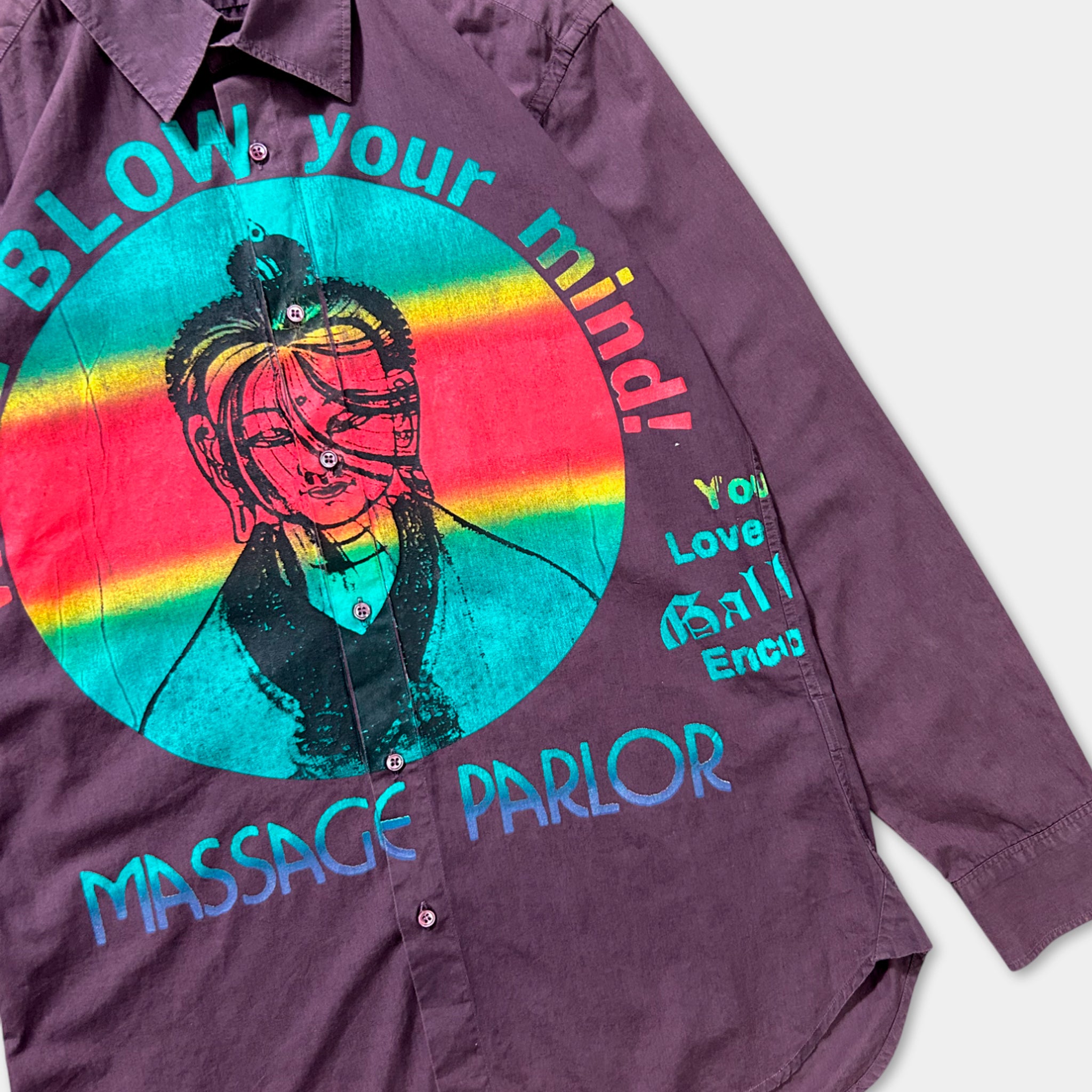 a purple shirt with a colorful graphic design and text printed on it.