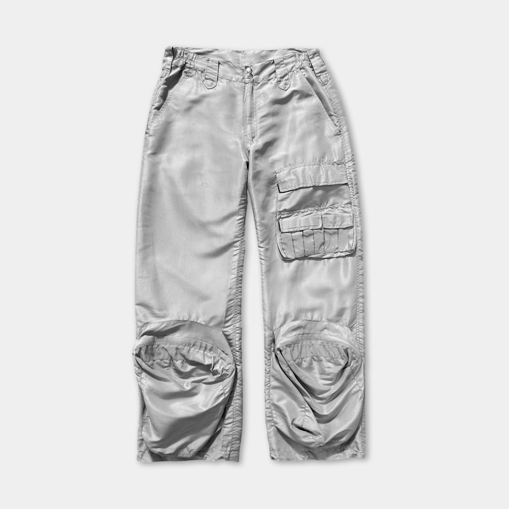 A pair of gray pants with multiple pockets and a zipper closure.