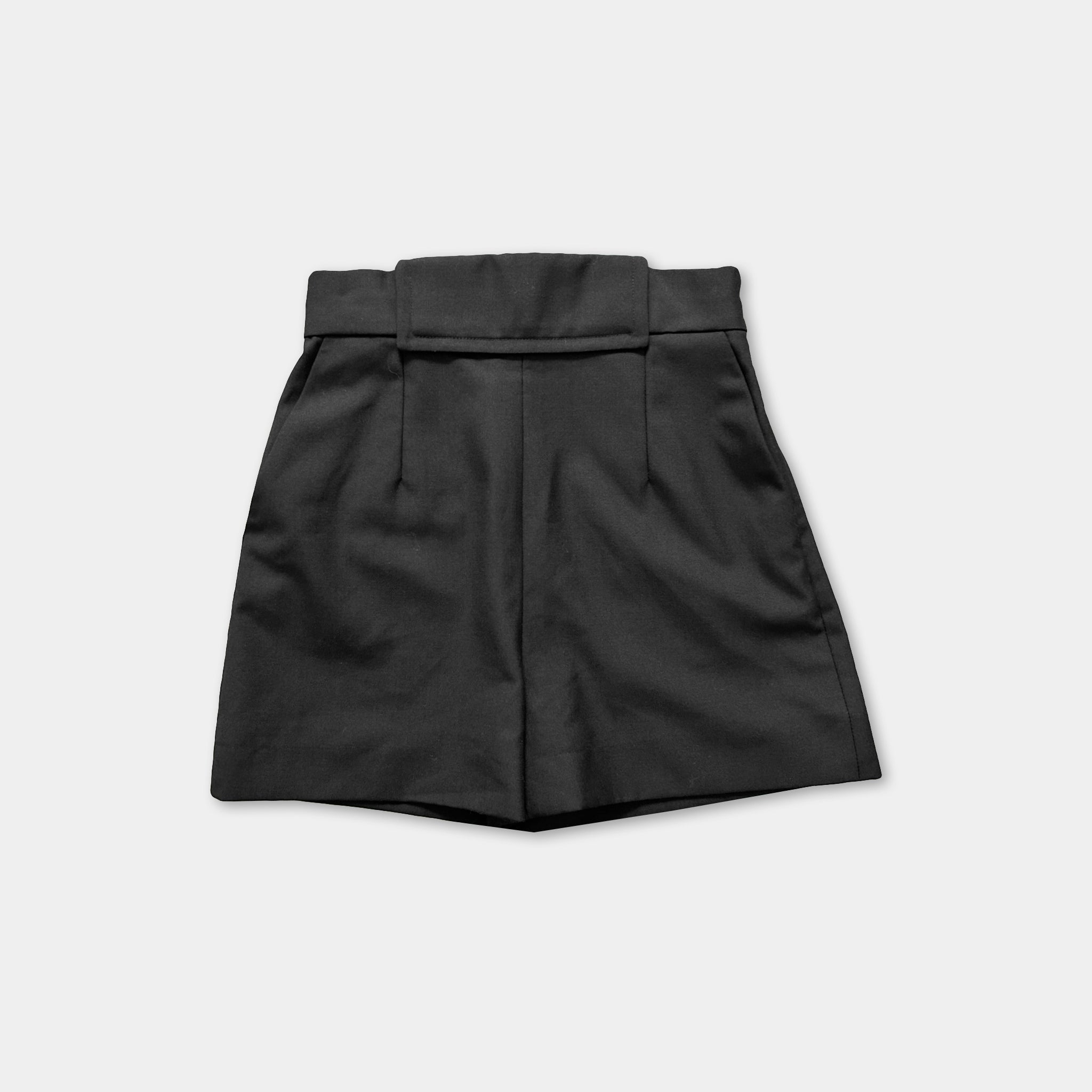 A pair of black shorts against a white background.