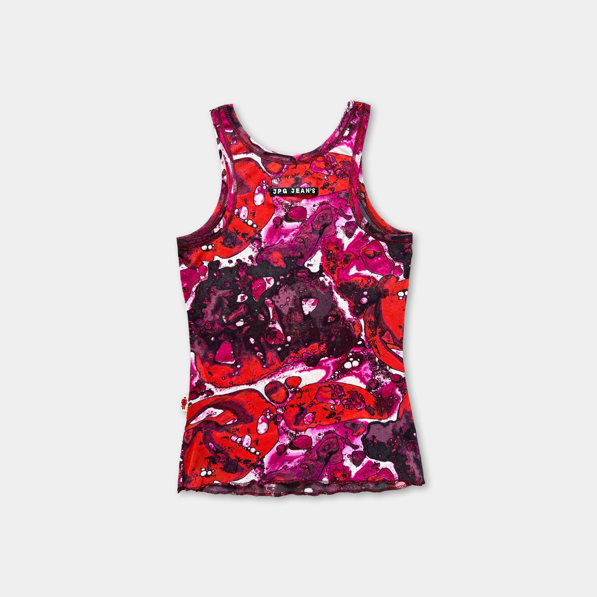 a colorful tank top with a vibrant, abstract pattern in shades of red, pink, and purple.