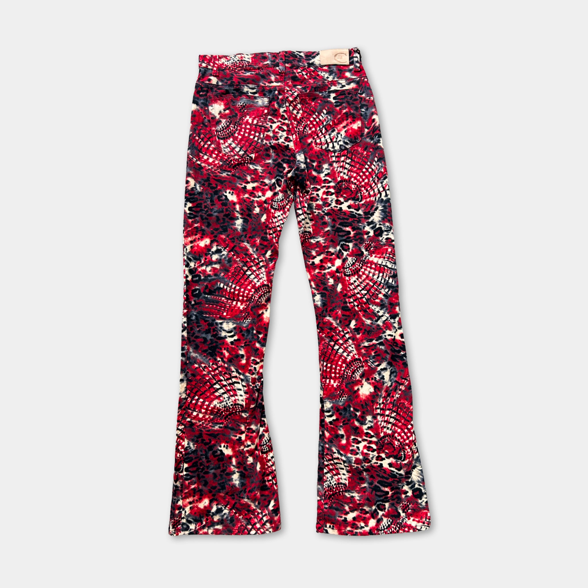 A pair of red and black patterned flared jeans.