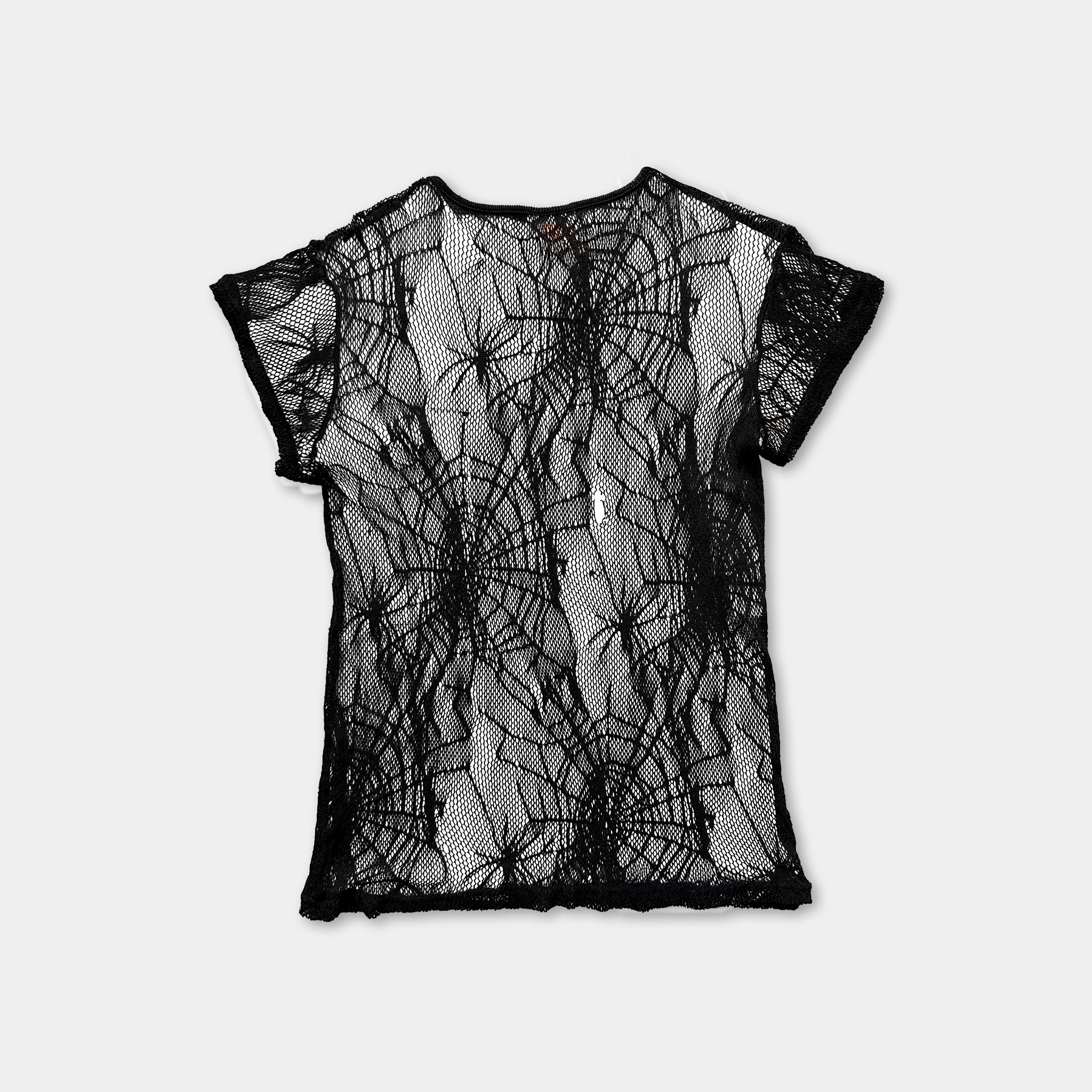a black lace top with a spider web pattern on it.