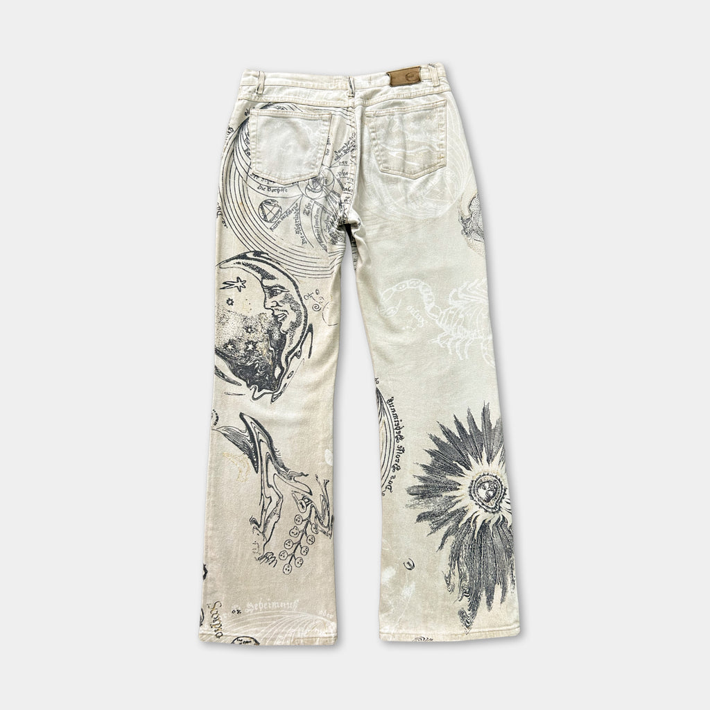 a pair of beige jeans with a unique, abstract pattern printed on them.