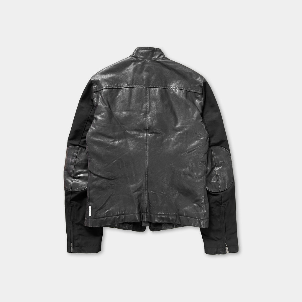 A black leather jacket with a high collar and long sleeves, displayed against a plain background.