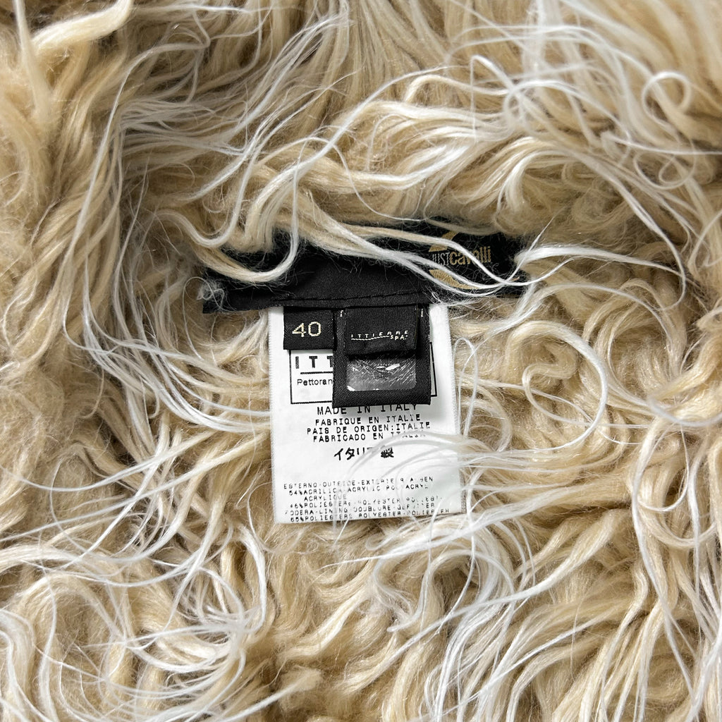 a close-up view of a soft, fluffy fabric with a label attached to it.