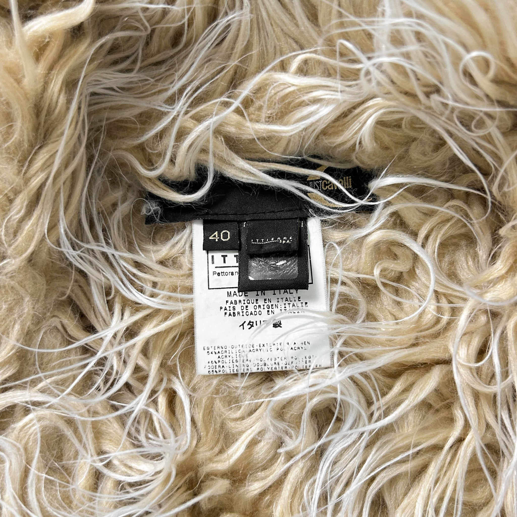 a close-up view of a soft, fluffy fabric with a label attached to it.