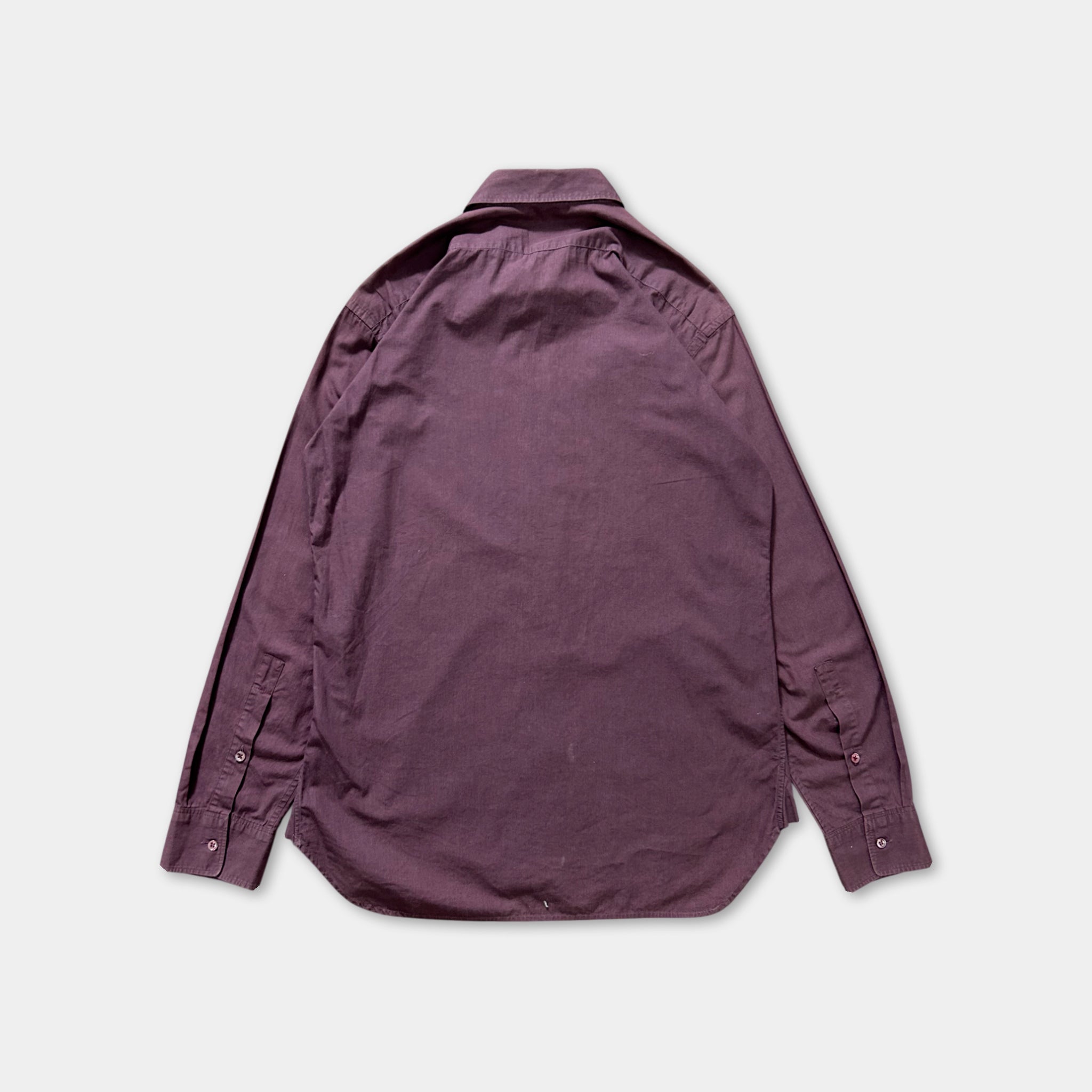 a purple shirt laid out on a white background.
