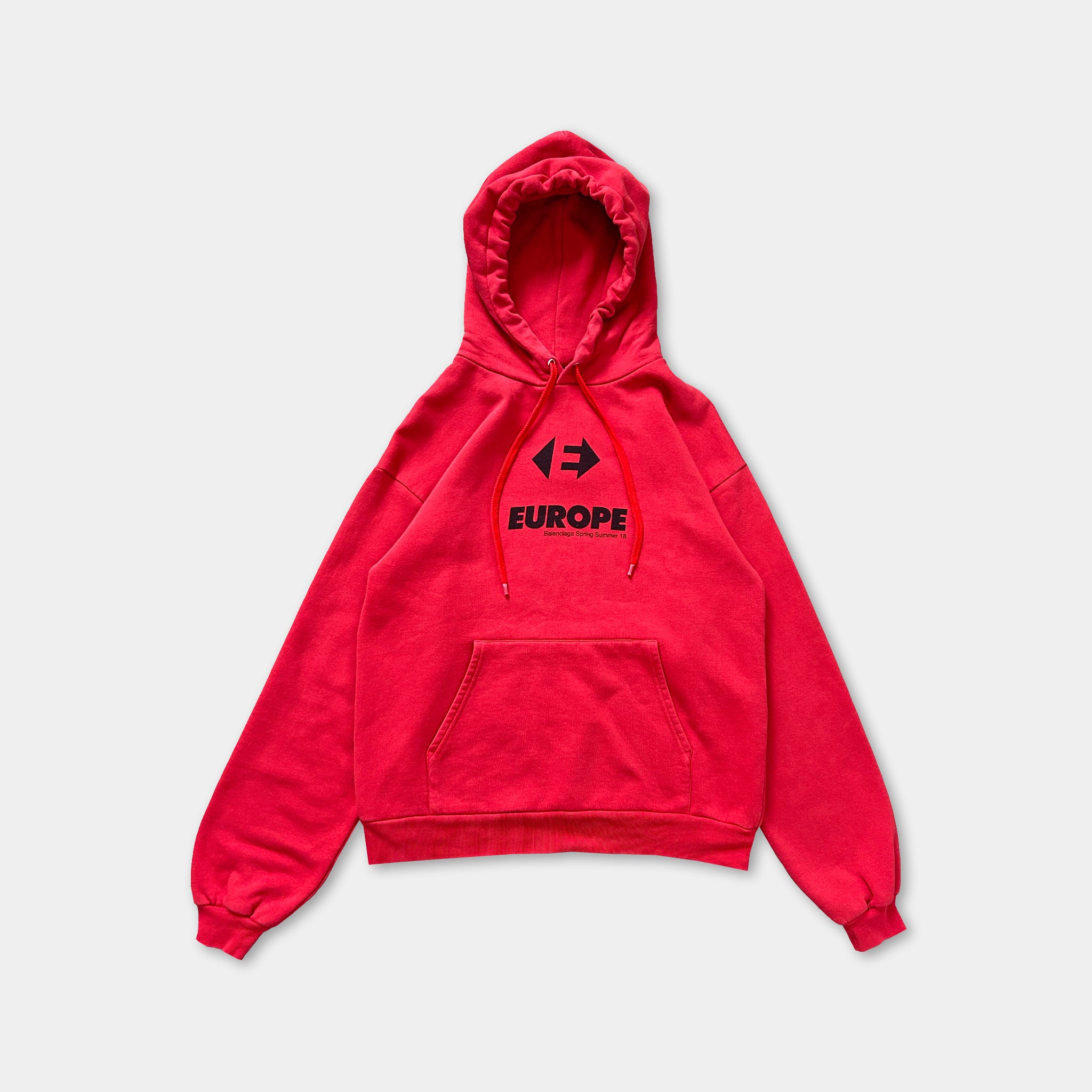 A red hooded sweatshirt with the word "EUROPE" printed on it.