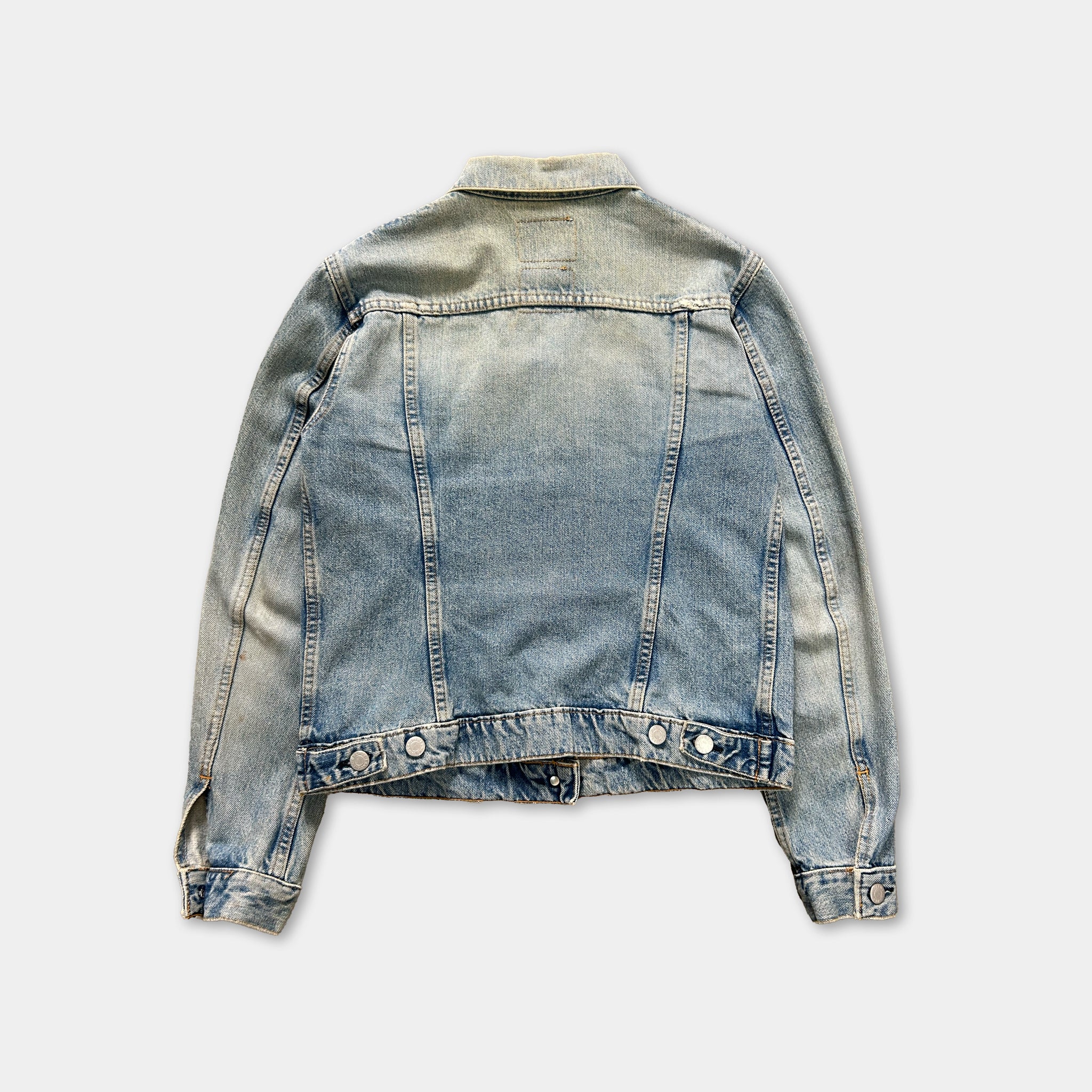 A denim jacket with a faded blue color and a collar is shown against a plain white background.