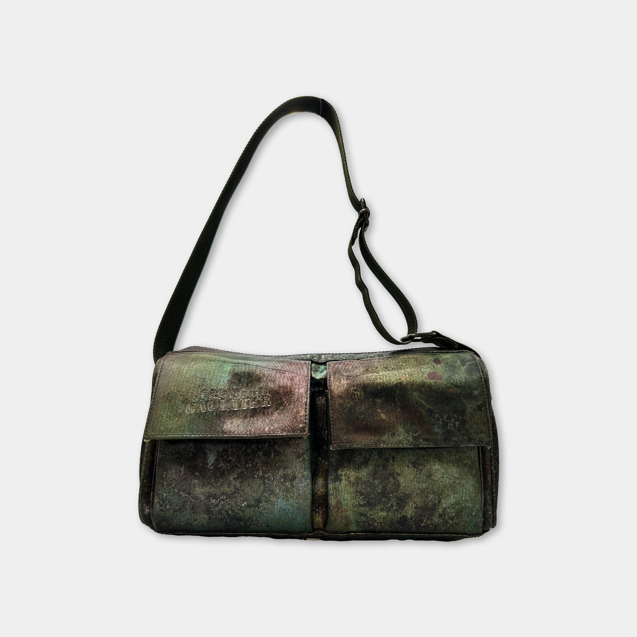 A green and black bag with a black strap, featuring a zipper closure and two pockets.