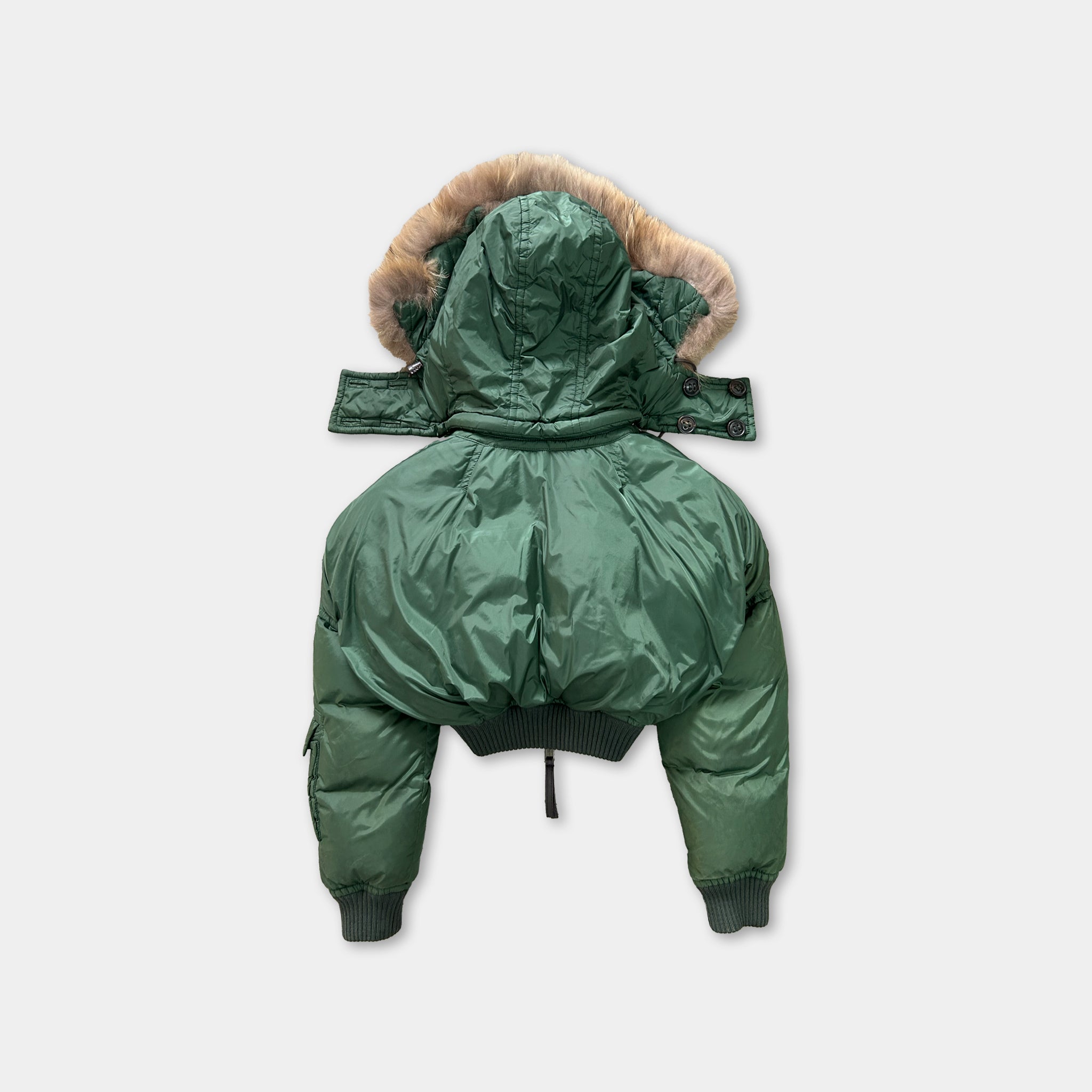 A green puffy jacket with a fur-lined hood is shown against a white background.